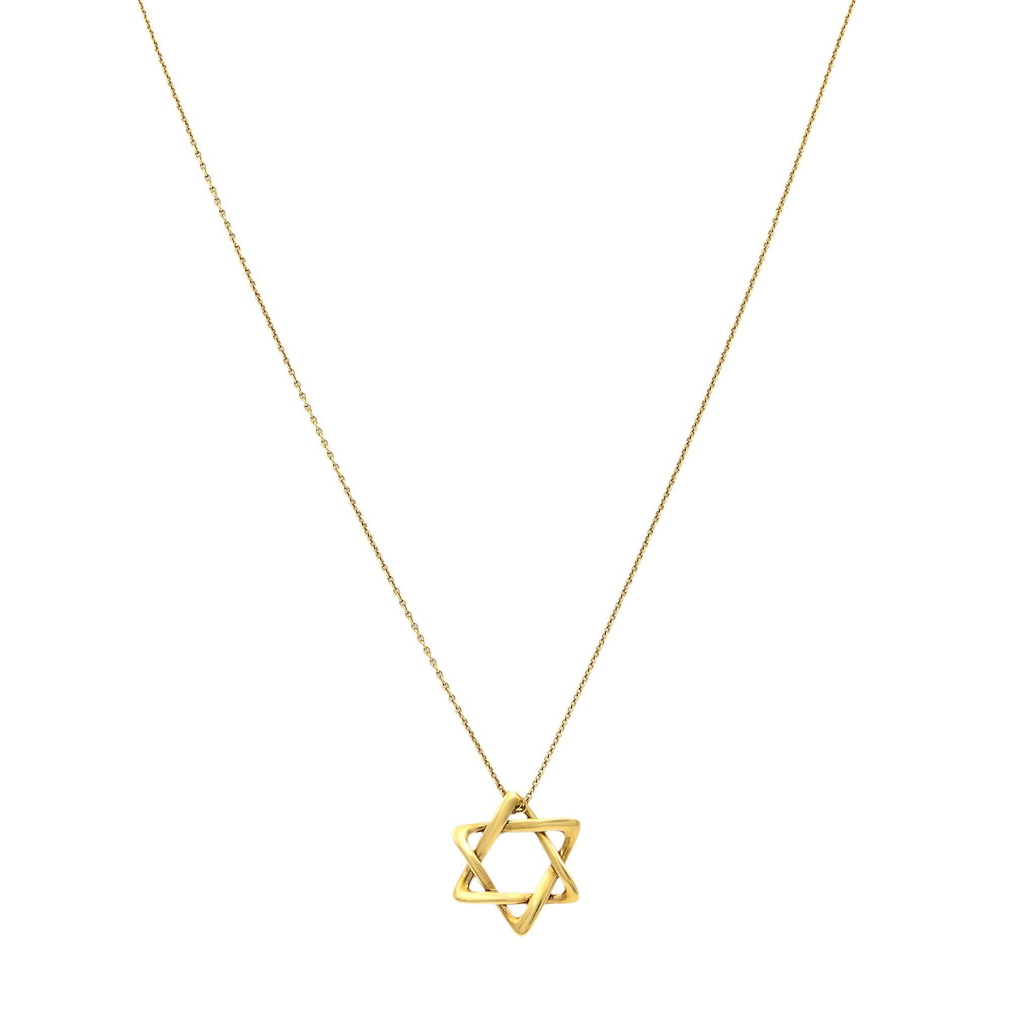 Tiffany & Co Star of David pendant in 18k gold, 12 mm wide. On a 16 inch chain. Original designs copyrighted by Elsa Peretti.
Excellent pre-owned condition. Box and papers are not included. 