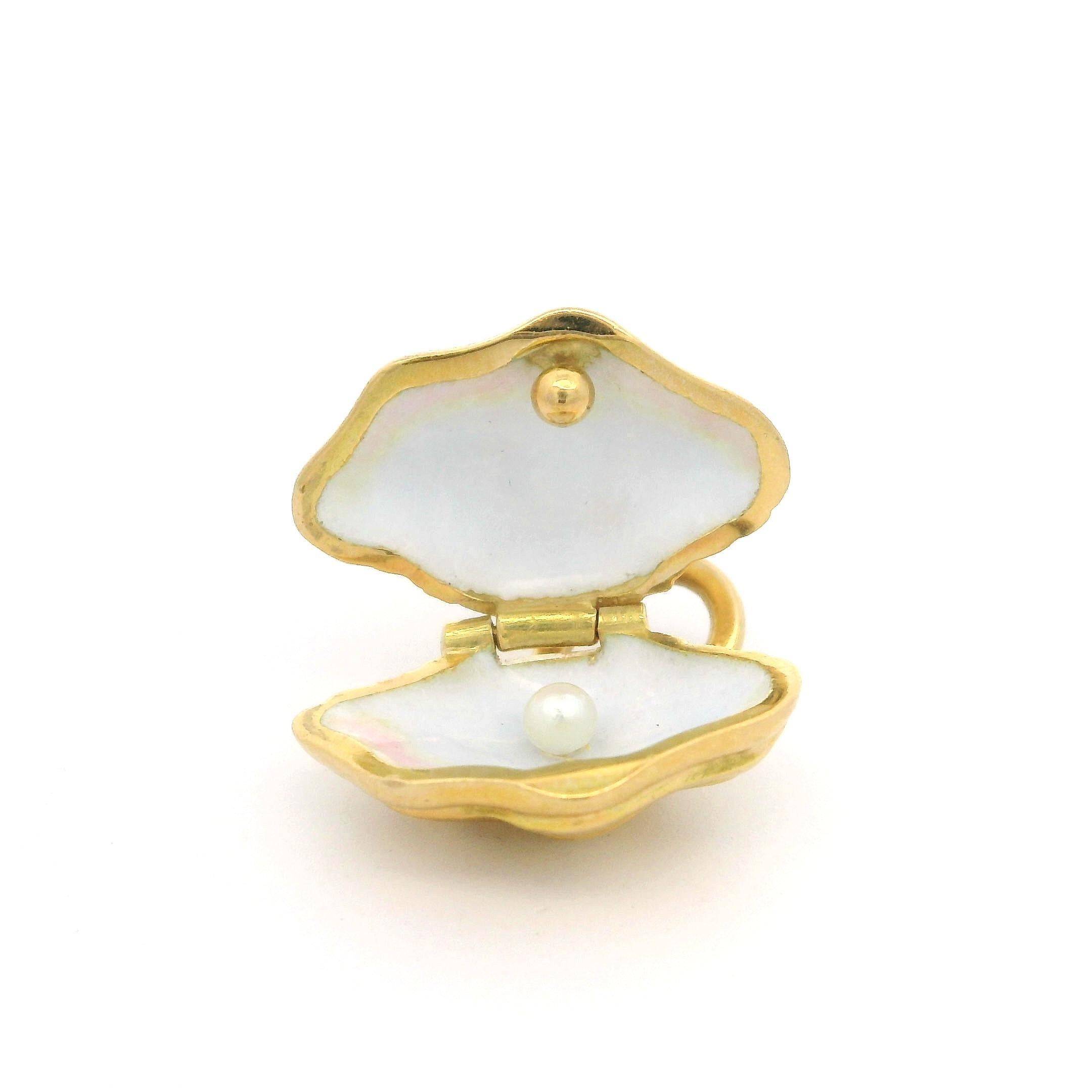 --Stones:--
1 Genuine Cultured Pearl - Round Shape - White Color - 2.4mm approx.

Material: Solid 18k Yellow Gold w/ White Enamel Work Inside Shell
Weight: 5.72 Grams
Chain : Not Included
Width: 16.5mm 0.65