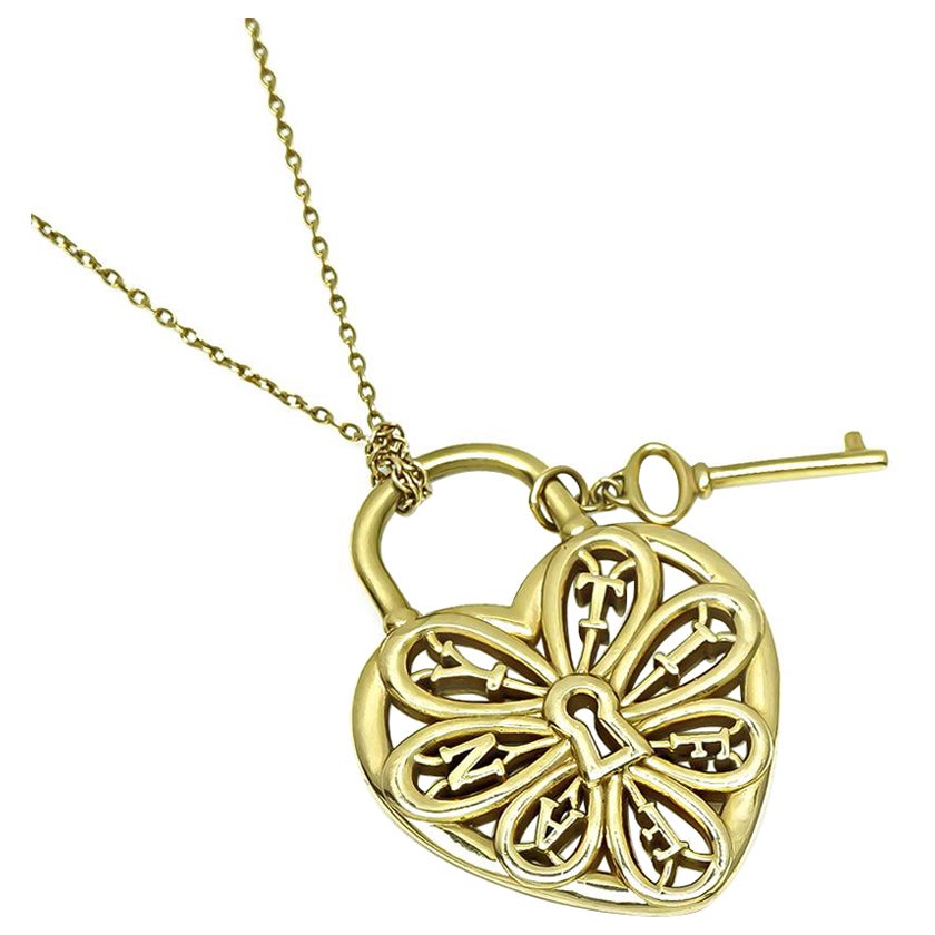 Tiffany & Co Collier pendentif cœur et clé en or jaune 18k en vente