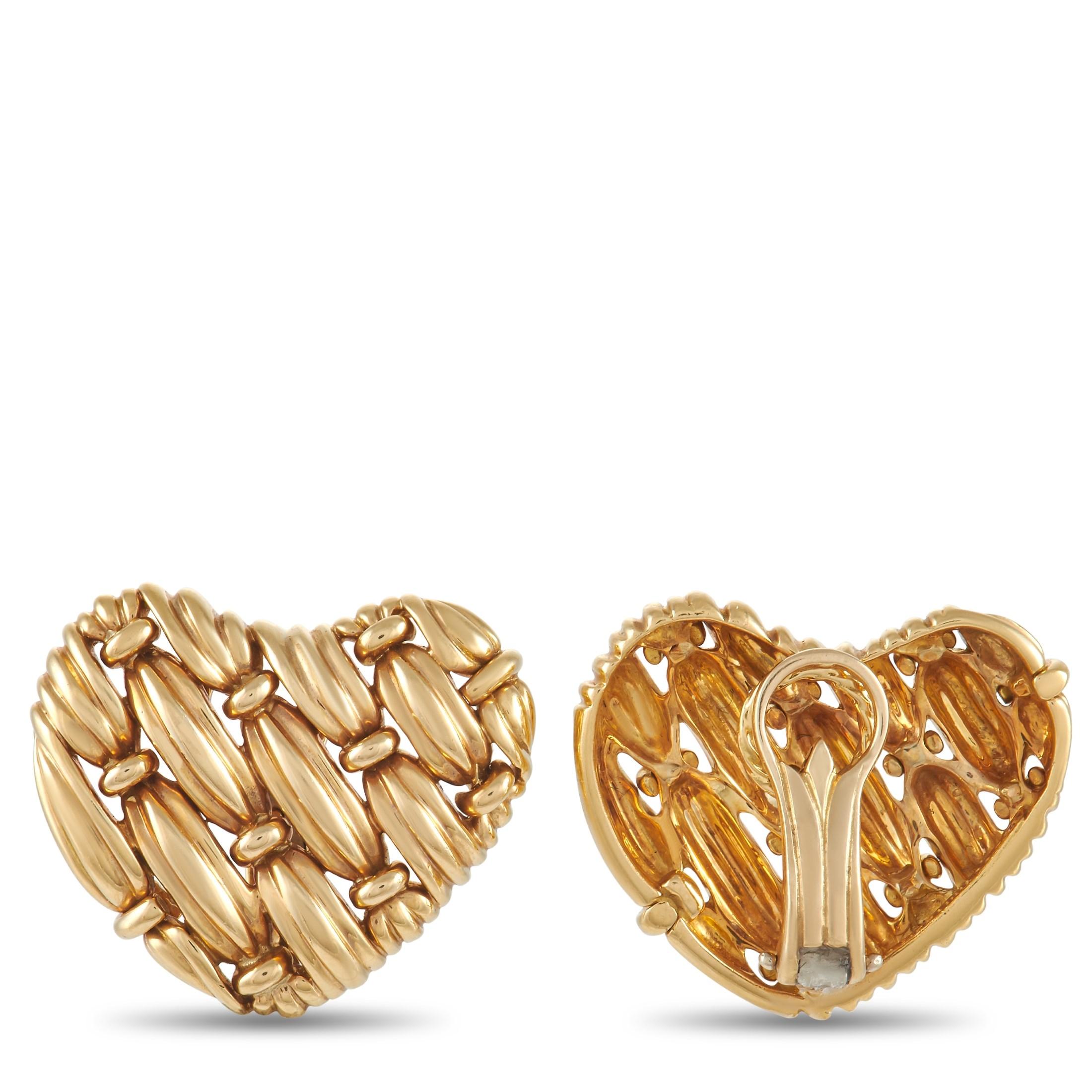 An intricate, textured design makes these heart-shaped earrings from Tiffany & Co. simply exquisite. Crafted from 18K Yellow Gold, each earring measures 0.95” long and 1.0” wide.

This jewelry piece is offered in estate condition and includes a gift