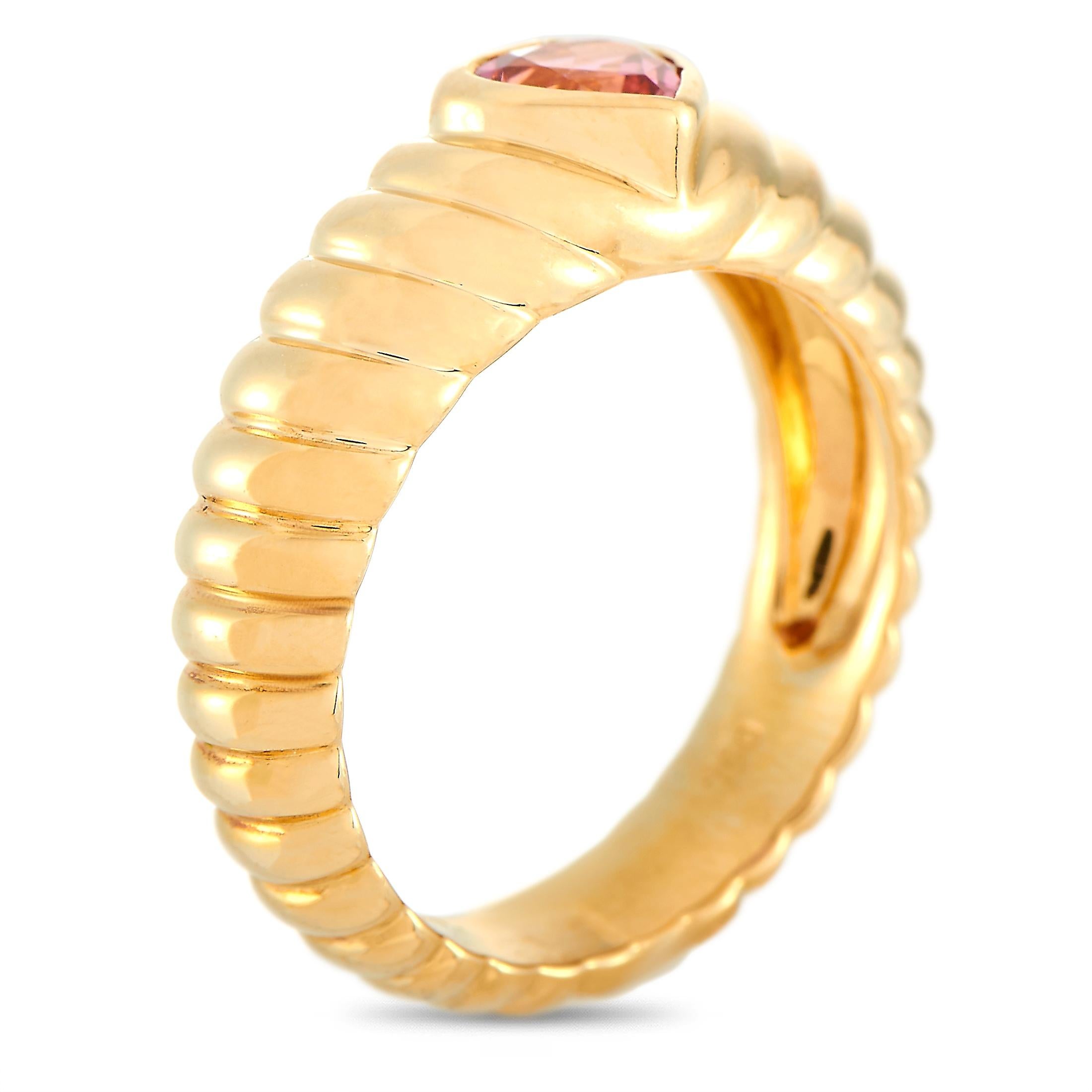 This Tiffany & Co. ring is crafted from 18K yellow gold and set with a heart-shaped tourmaline. The ring weighs 5.3 grams and boasts band thickness of 5 mm and top height of 5 mm, while top dimensions measure 6 by 6 mm.
 
 Offered in estate
