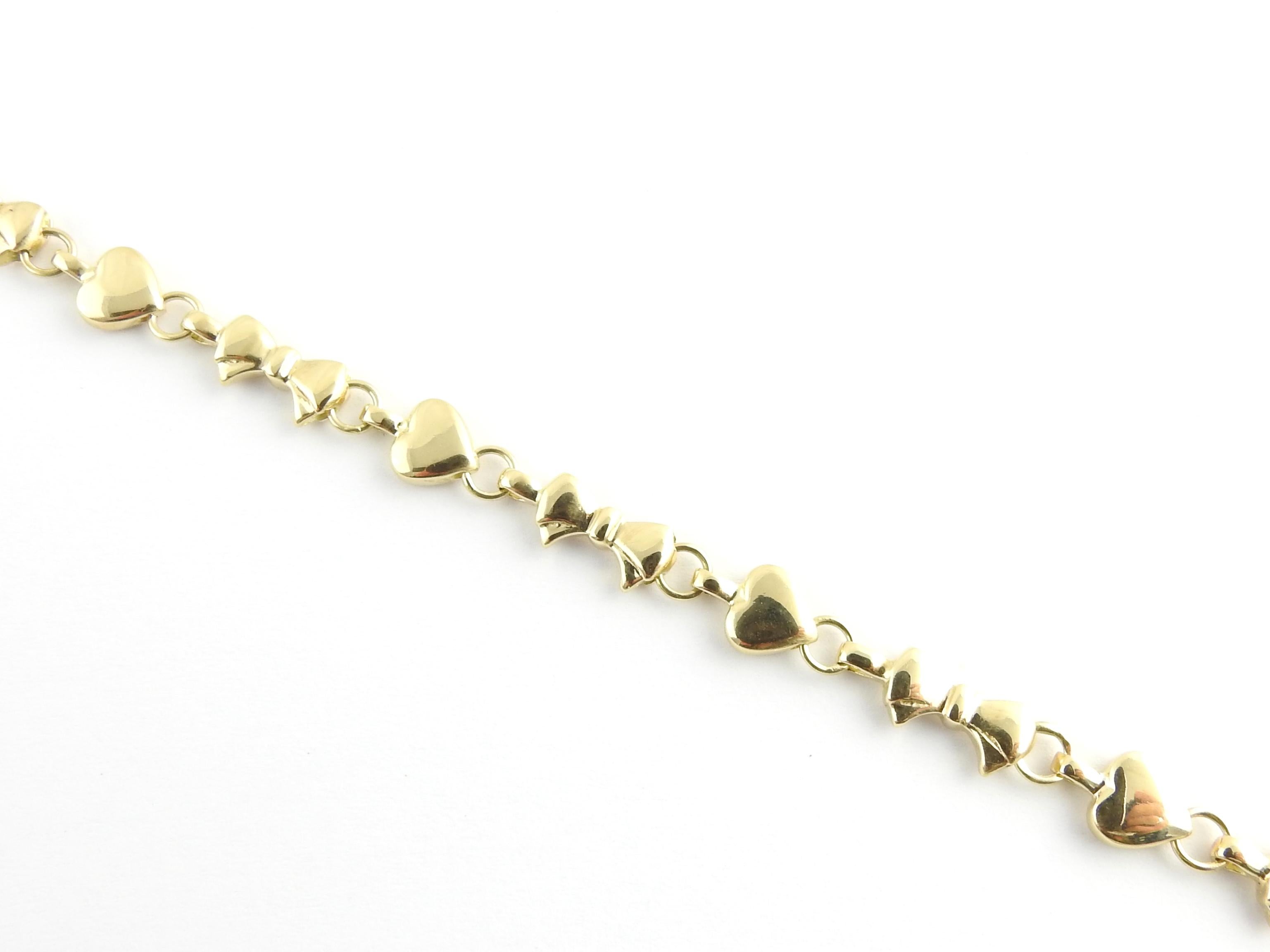 Tiffany & Co. 18 Karat Yellow Gold Hearts and Bows Link Bracelet In Good Condition In Washington Depot, CT