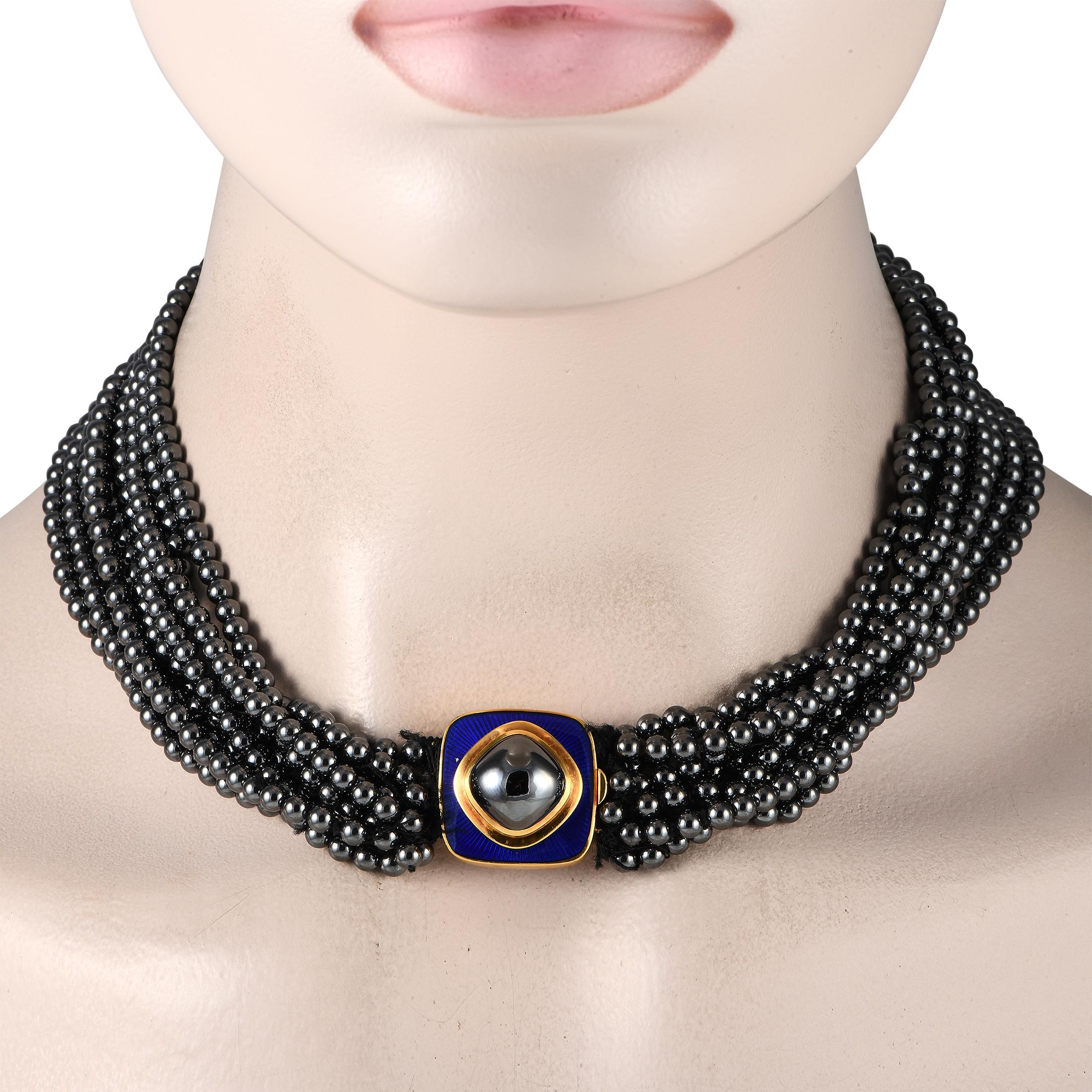 One can't deny the enigmatic allure of this black beaded choker necklace by Tiffany & Co. This dazzler features multiple bead strings in metallic grey. A yellow gold and enamel pendant, which also serves as the necklace's fastener, is punctuated by
