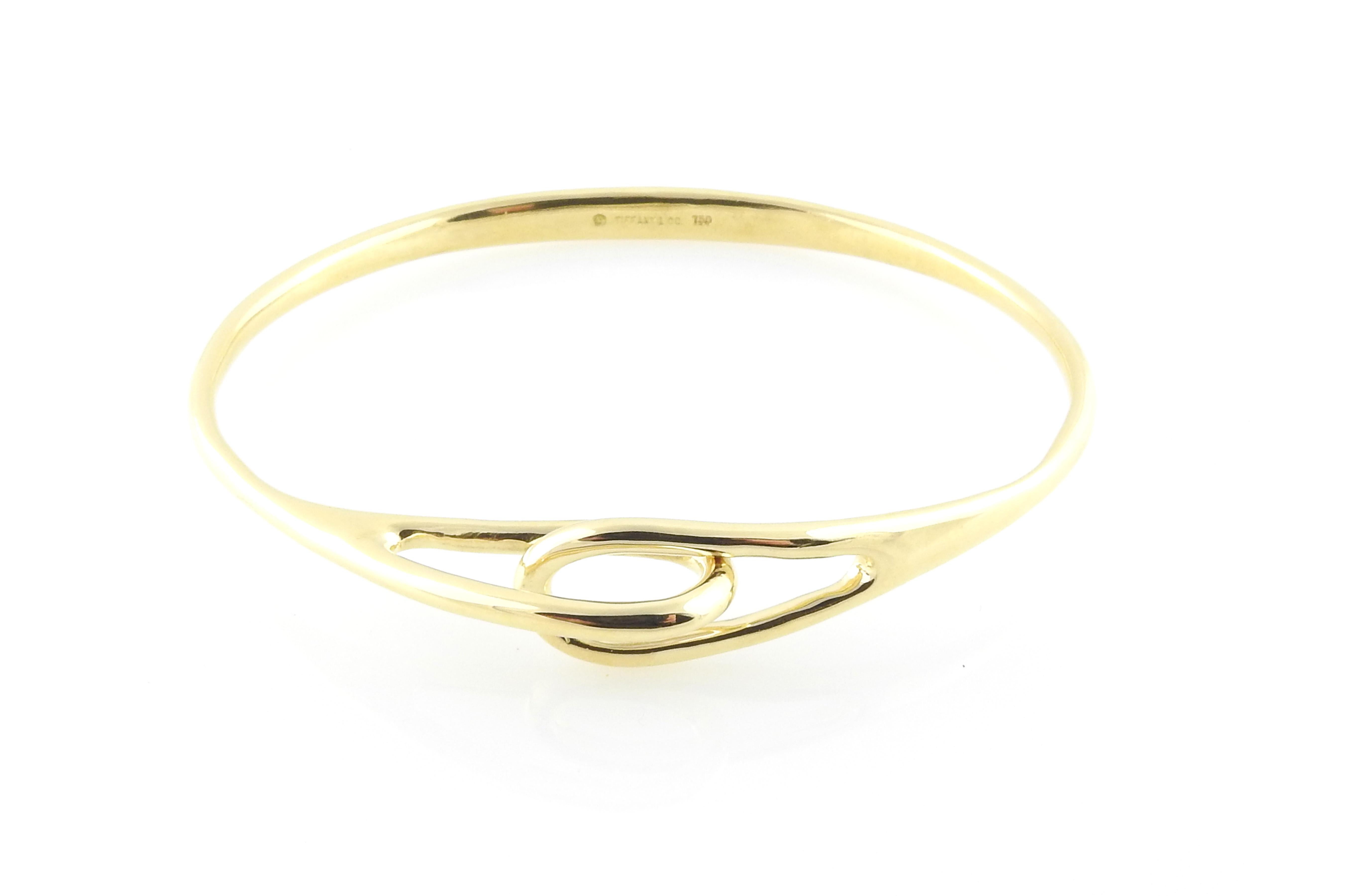 Tiffany & Co. 18K Yellow Gold Interlocking Double Loop Bangle

This gorgeous bangle bracelet measure approx. 7