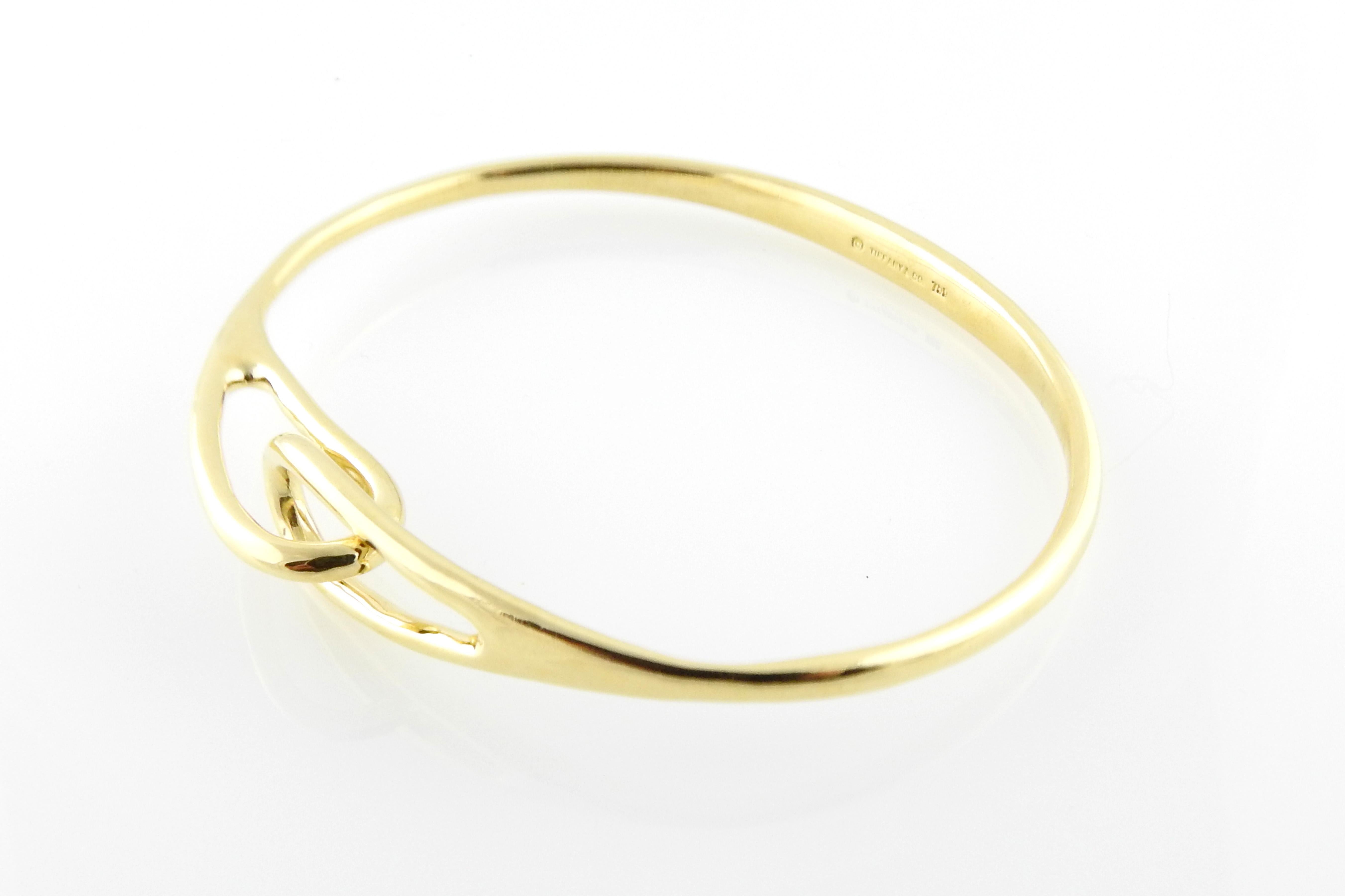 Tiffany & Co. 18K Yellow Gold Interlocking Double Loop Bangle

This gorgeous bangle bracelet measure approx. 7