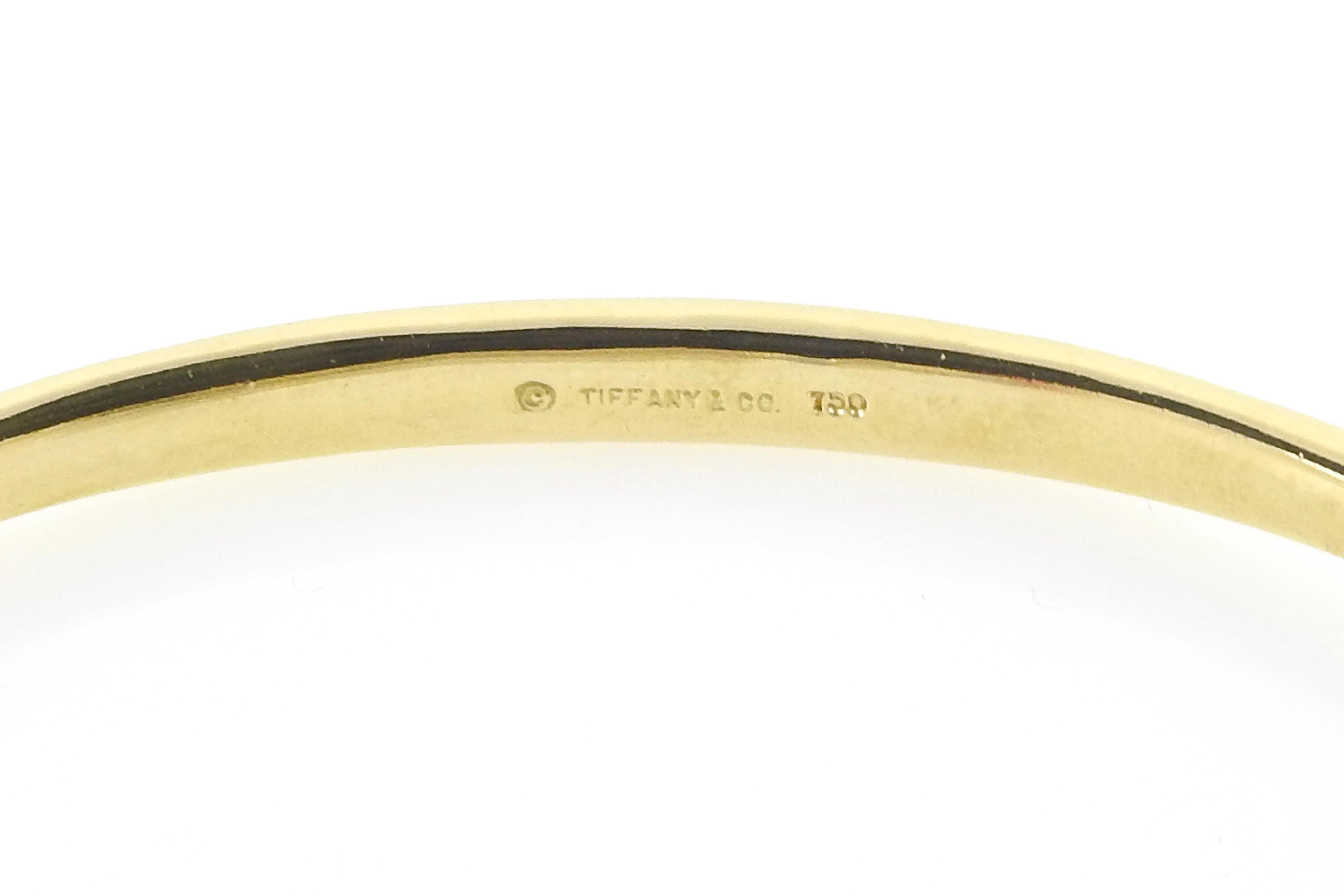 Tiffany & Co. 18K Yellow Gold Interlocking Double Loop Bangle Bracelet In Good Condition In Washington Depot, CT