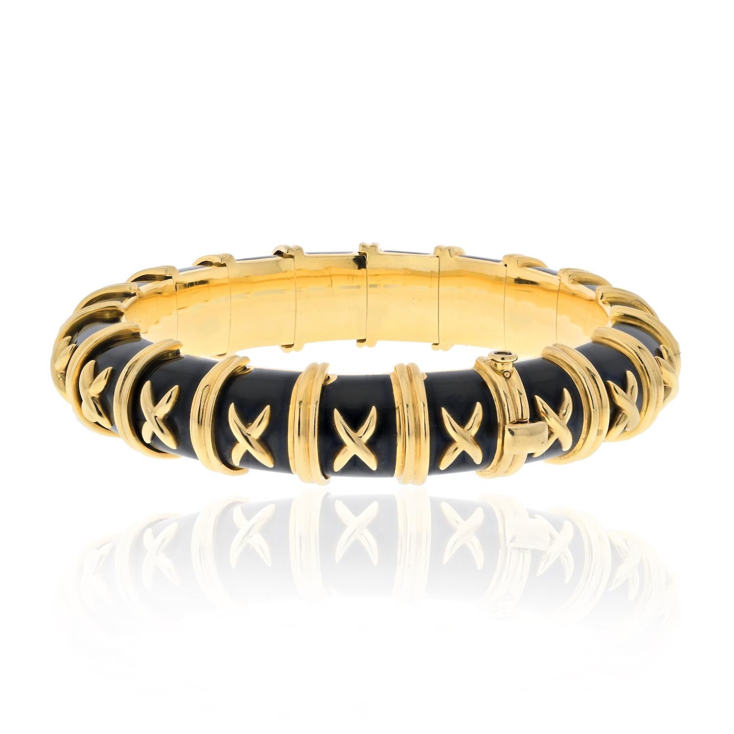 Introducing the exquisite 18K Schlumberger Croisillon Bracelet, a true testament to the iconic style and artistry of Jean Schlumberger. This captivating bracelet is crafted in 18K gold and features a mesmerizing design that exudes elegance and