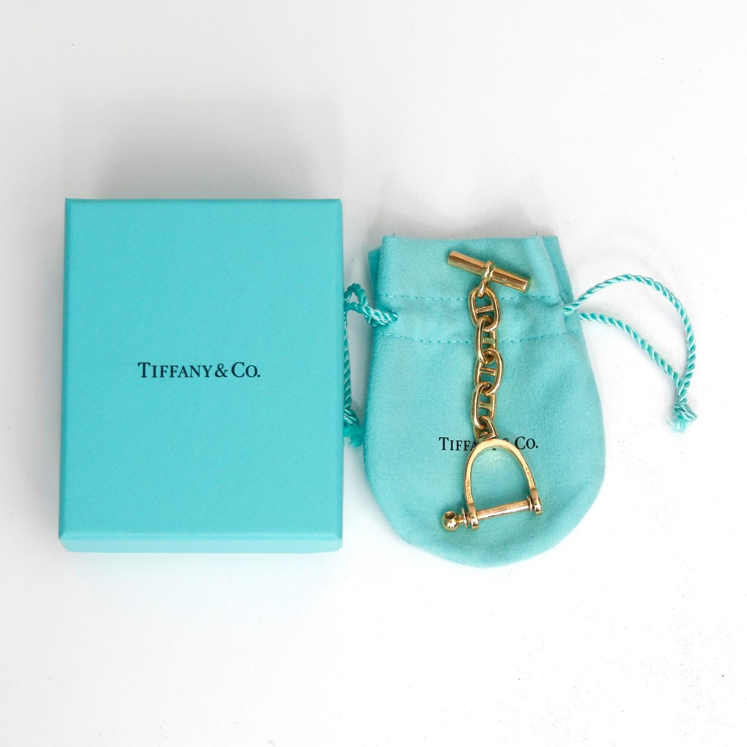 Tiffany & Co 18K Yellow Gold Key Chain  -  3 inches long, in fine condition and heavy weighing 22 grams. One will find the silver examples but this model is classic and unusual and not made by Tiffany today. Signed with the 18K gold mark.