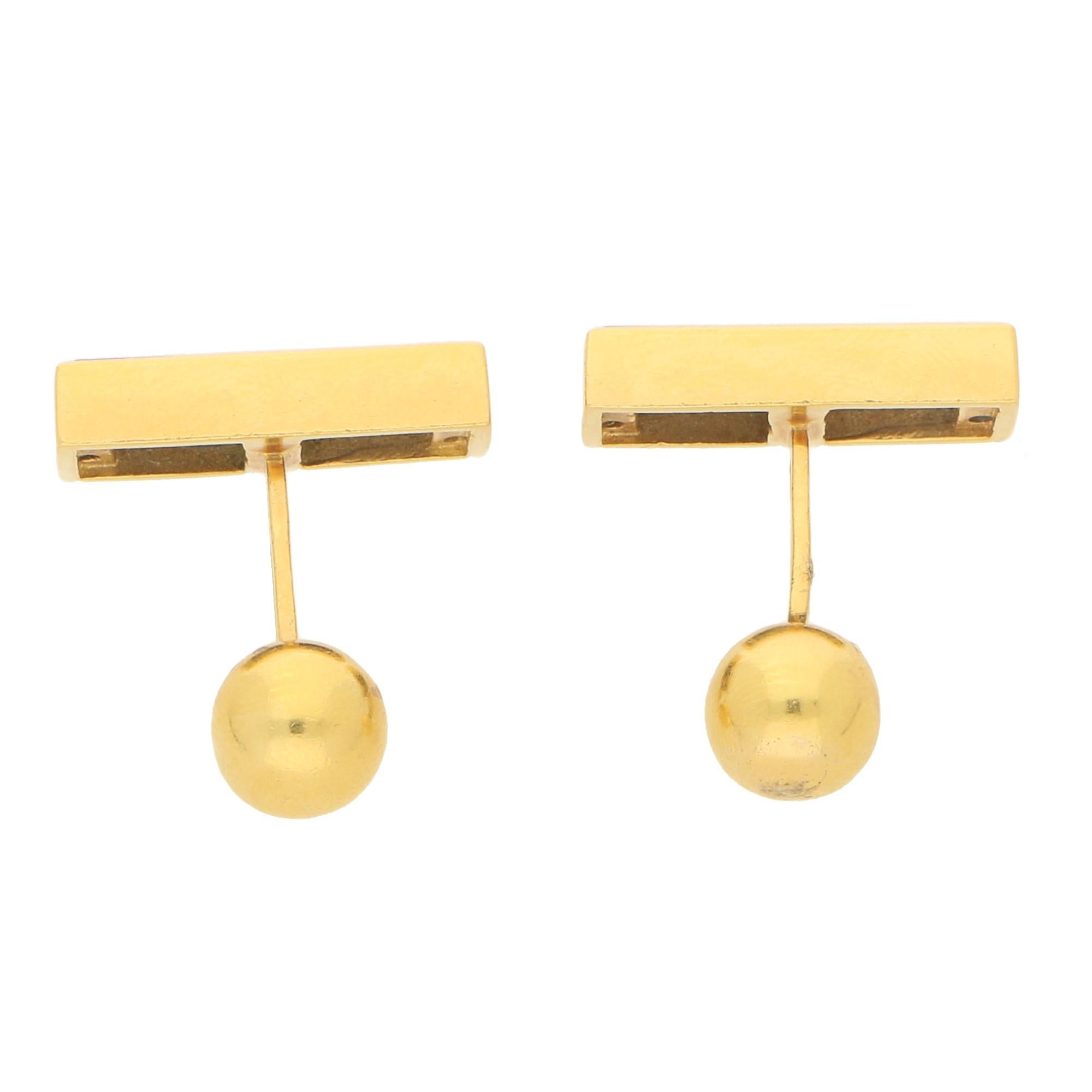 A striking pair of Tiffany & Co cufflinks set in solid 18 carat yellow gold. The pair are each set with two rectangular cut panels of lapis lazuli of a royal blue colour. 
 
Set to each end is a ball fitting. Stamped TIFFANY&CO

