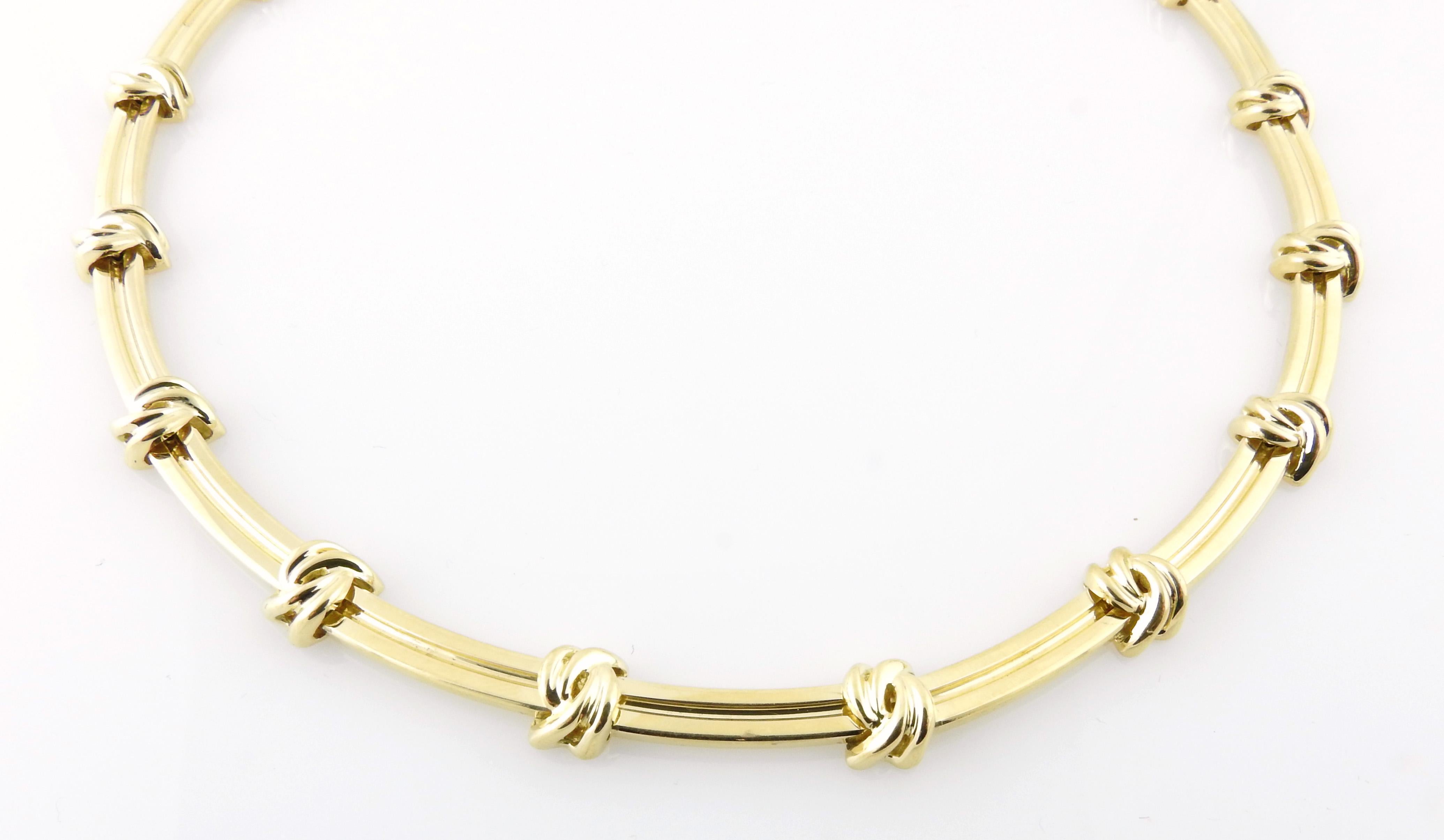 Tiffany & Co. 18K Yellow Gold Love Knot Groove Link Choker

This beautiful Tiffany & Co. Choker is set in 18K Yellow Gold

approx. 15.5
