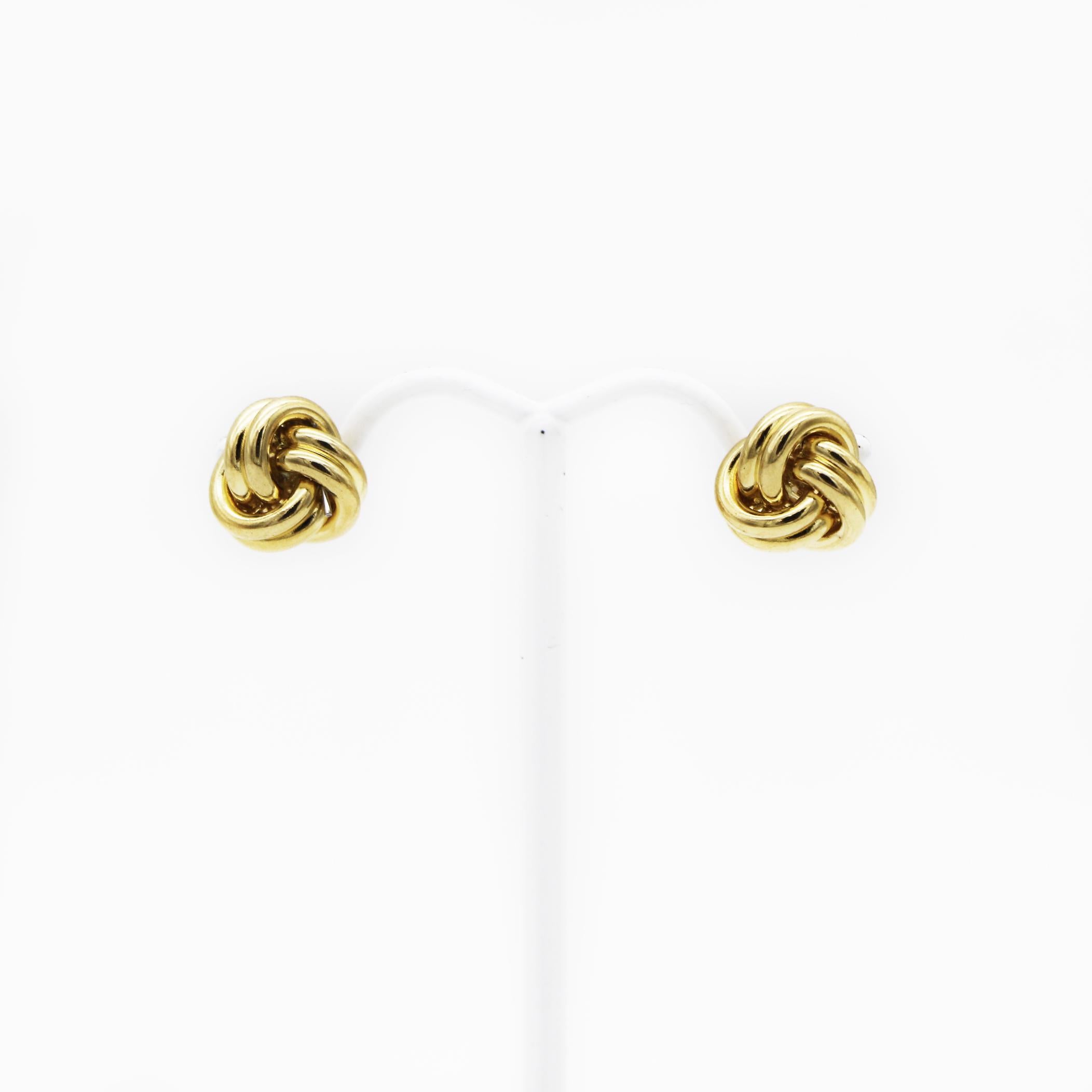 Tiffany & Co.
18K Gold
Love Knot
Stud Earrings
Approx.  11mm H x 11mm W x 16mm D
Approx. weight of 8.1 grams
Well fitted 18K Gold off market butterfly backings
In great looking condition
wear consistent with time and some light use
such as light