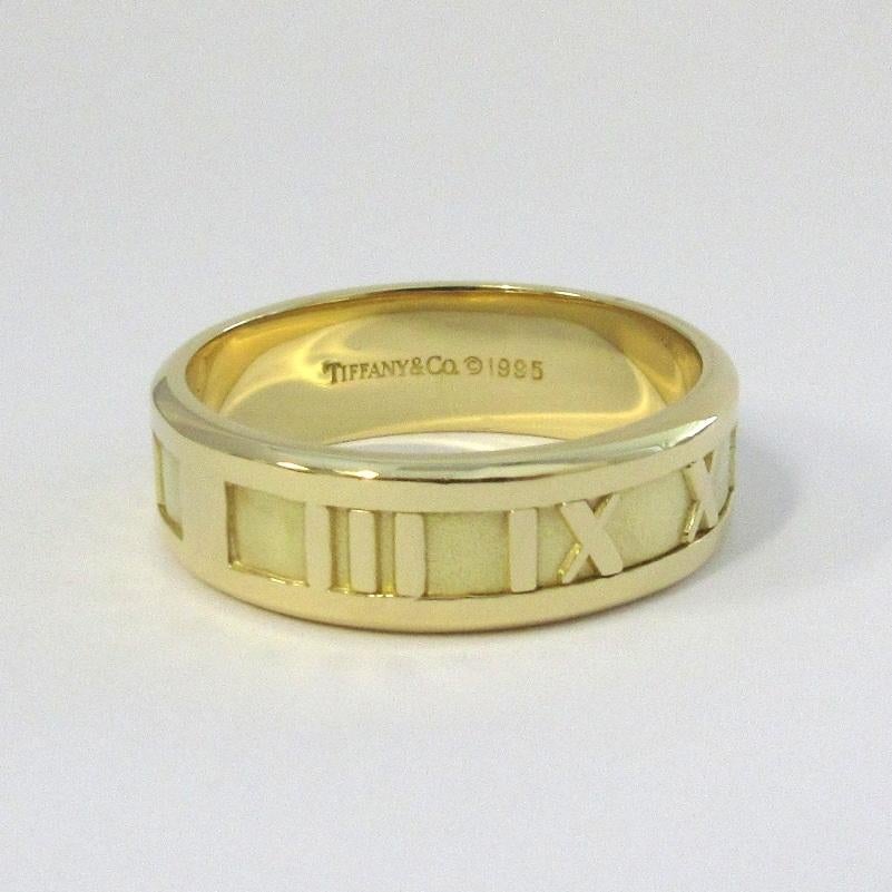 TIFFANY & CO. 18K Yellow Gold Numeric Atlas Ring 10.5 Men's

Metal: 18K Yellow Gold
Size: 10.5 
Band Width: 7mm
Weight: 9.70 grams
Hallmark: TIFFANY&CO.©1995 750 ITALY
Condition: Excellent condition


Limited edition, no longer available for sale in