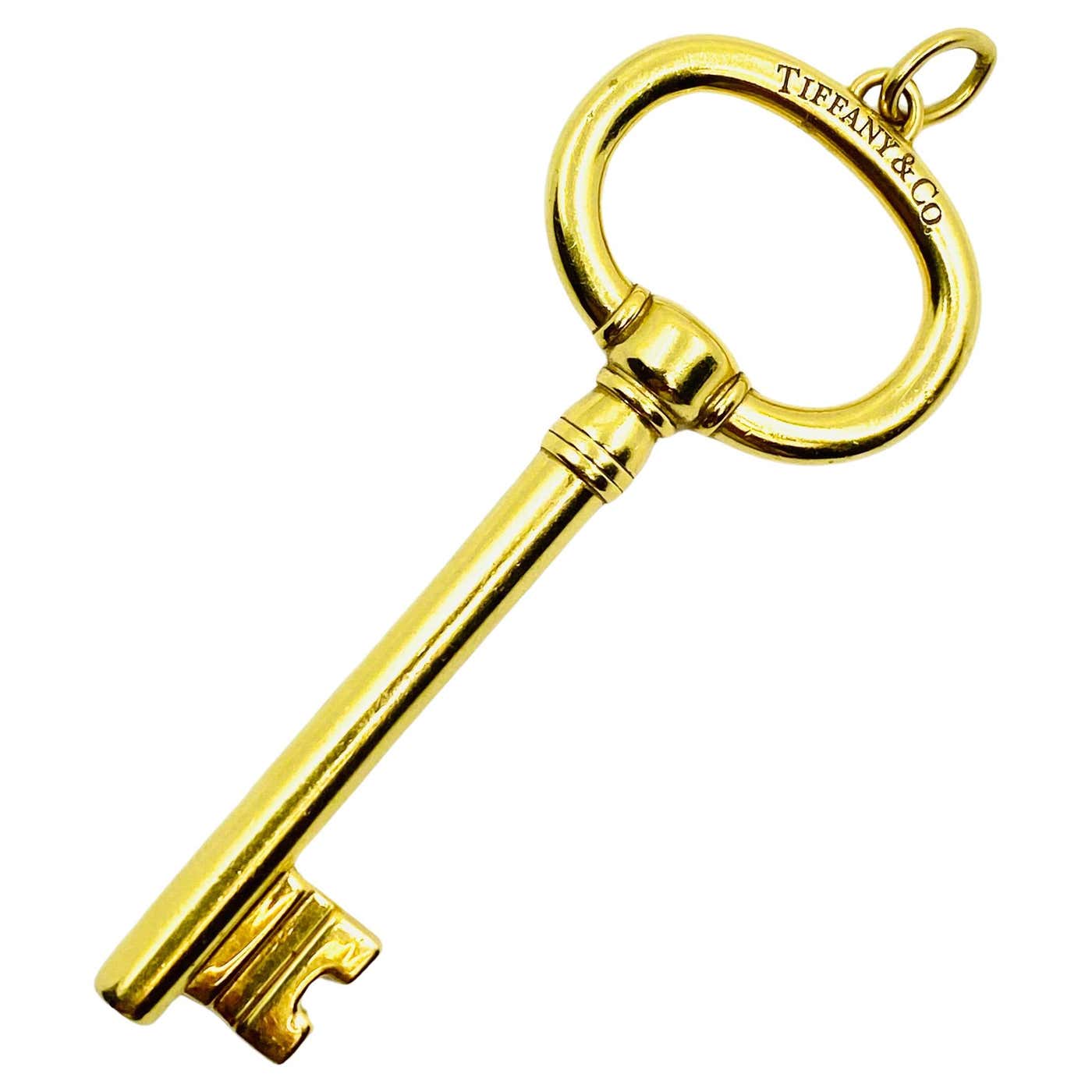 Triangle Gold Key Tiffany and Co. 18k Yellow Gold Oval Key Pendant For Sale at 1stDibs