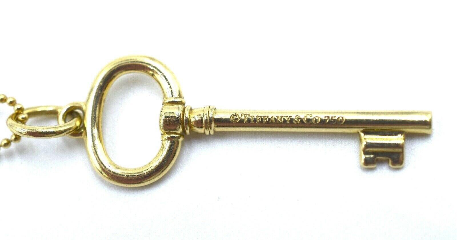 18k gold key pendant