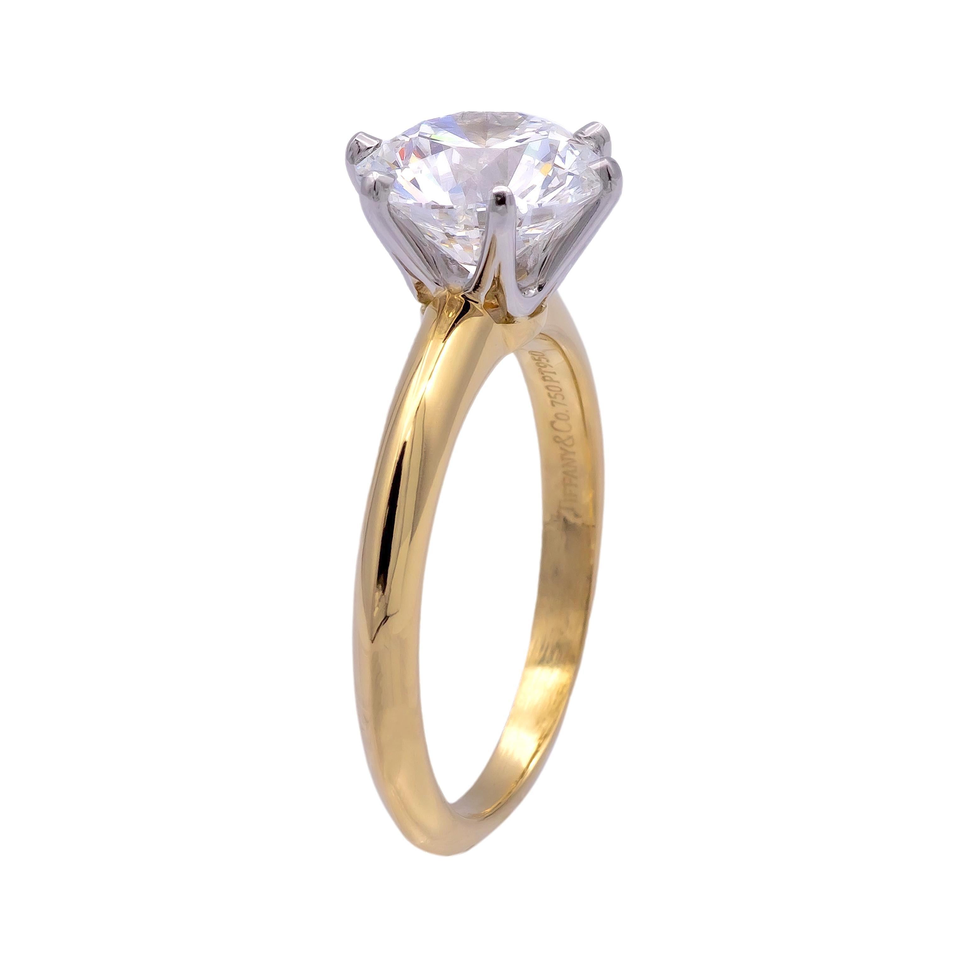 Pre-owned Vintage Tiffany & Co. solitaire diamond engagement ring, expertly crafted with a 6-prong platinum setting and an 18K yellow gold shank. The ring is in excellent condition , and features a round brilliant-cut center diamond weighing 2.42