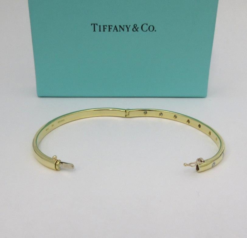 Tiffany & Co. 18k Yellow Gold Platinum Diamond Etoile Bangle Bracelet In Excellent Condition For Sale In Los Angeles, CA
