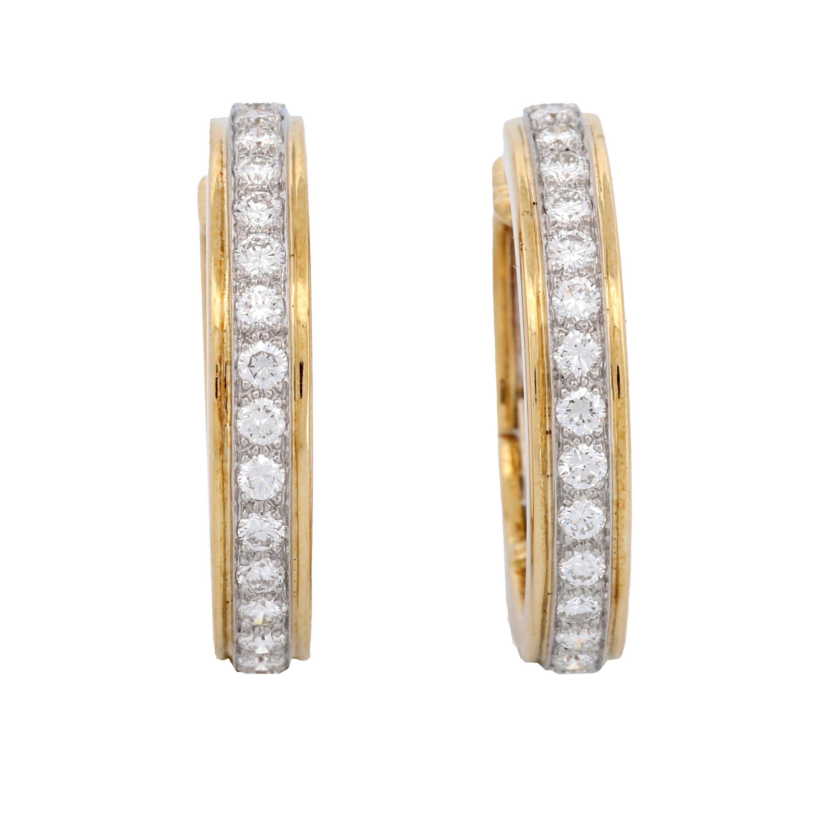 
Elevate your sense of elegance and luxury with these breathtakingly stunning diamond hoop earrings from the renowned Tiffany & Co. Crafted with an unmatched level of precision and care. These earrings embody the essence of sophistication and