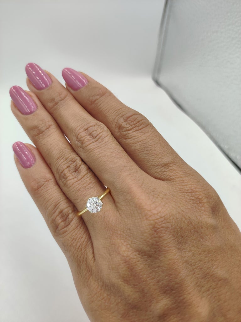 Tiffany & Co. 18K Yellow Gold & Platinum 0.99 ct Total Weight Round Brilliant Cut Diamond Solitaire Engagement Ring. 

The ring weighs 3 grams, size 5.25, the center stone is a Natural Round Brilliant Cut diamond weighing 0.99 ct, H in color, VVS1