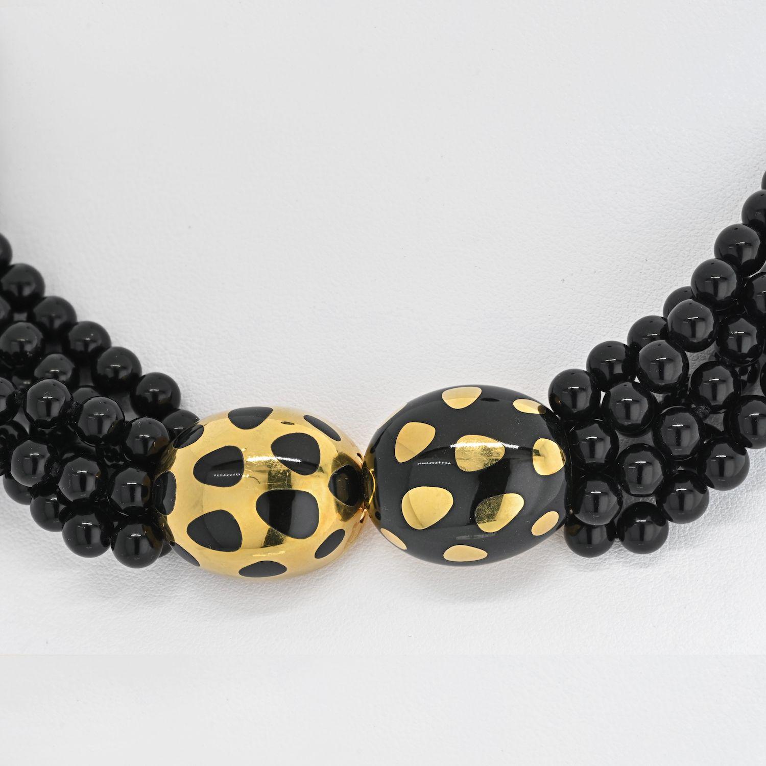 Angela Cummings for Tiffany & Co. torsade necklace by Angela Cummings finely crafted in 18 karat yellow gold with multiple strands of 5.5-5.7mm black jade beads. The beads are held by positive/negative design with a push-down tongue clasp,