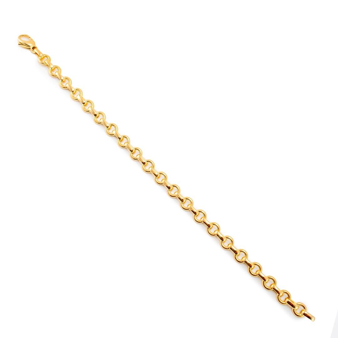 Brand: Tiffany & Co.

Metal Type: 18K Yellow Gold

Length: 6.50 inches

Width: 6.00 mm tapering to 4.05 mm

Weight: 15.87 grams

18K yellow gold link bracelet. The metal was tested and determined to be 18K yellow gold. Engraved with 