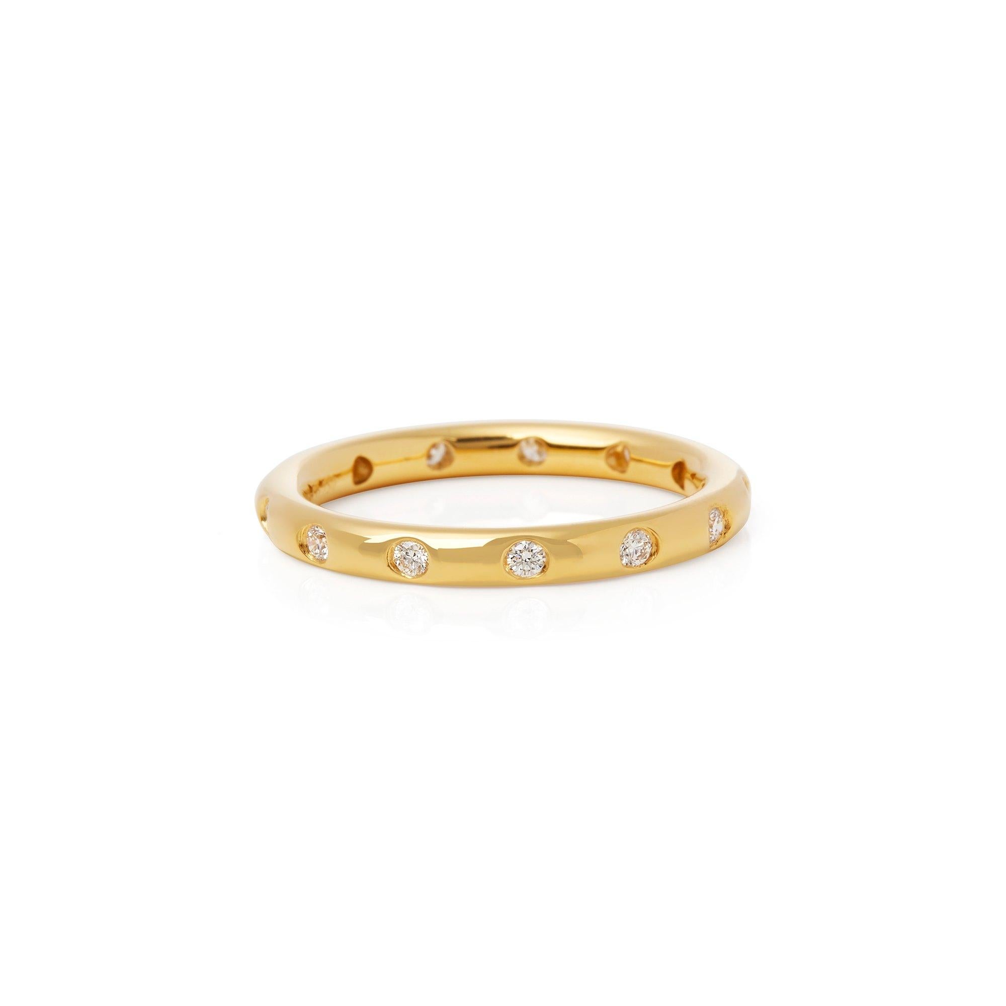 This Wedding Ring by Elsa Peretti for Tiffany & Co features Thirteen Round Brilliant Cut Diamonds Totalling 0.26cts. Set in 18k Yellow Gold. Finger Size UK O 1/2, EU Size 55, USA Size 7. Complete with Xupes Presentation Box. Our Xupes reference is