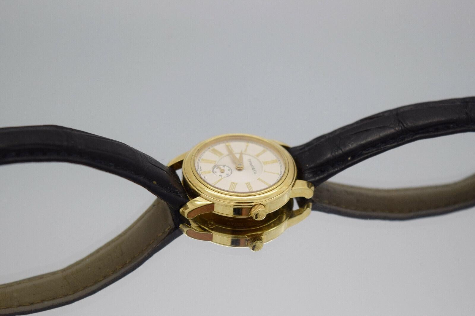 Tiffany & Co 18k Yellow Gold Round Roman Dial Quartz Watch 27mm In Good Condition For Sale In Providence, RI