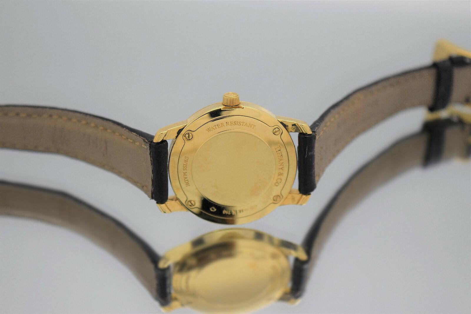 Tiffany & Co 18k Yellow Gold Round Roman Dial Quartz Watch 27mm For Sale 1