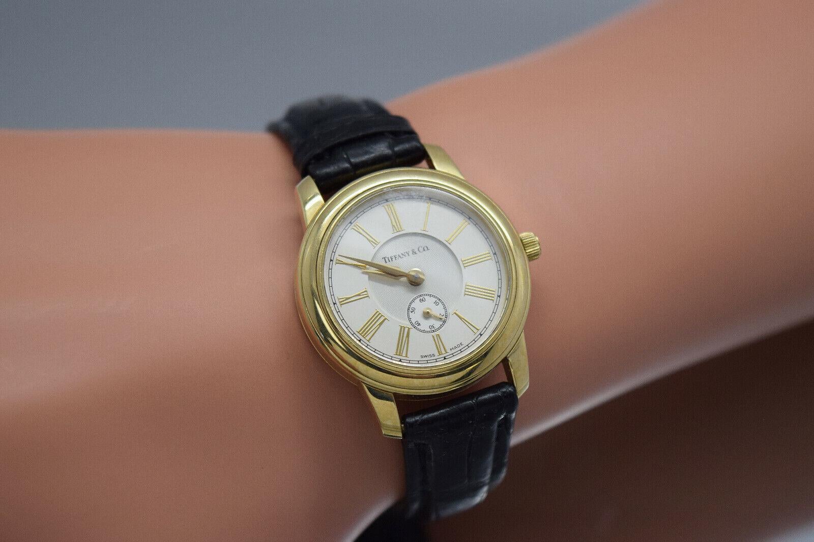 Tiffany & Co 18 Karat Gelbgold Quarz-Uhr mit rundem römischem Zifferblatt 27 mm