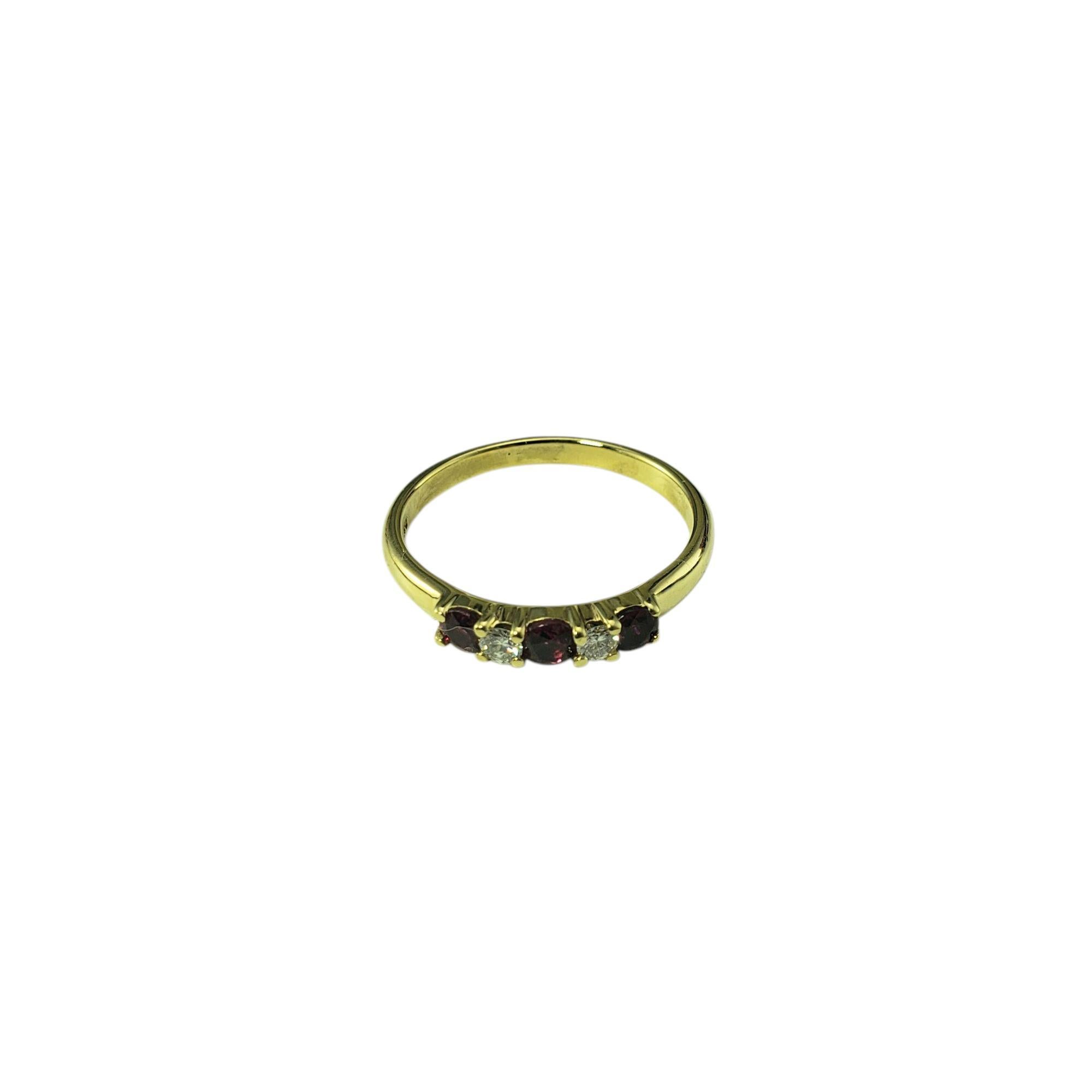 Tiffany & Co. 18K Yellow Gold Ruby and Diamond Ring Size 6.5

Elegant and timeless, this Tiffany & Co. ring features three red ruby gemstones and two round brilliant cut diamonds set in classic 18K yellow gold. 

Width: 3 mm. Shank: 2
