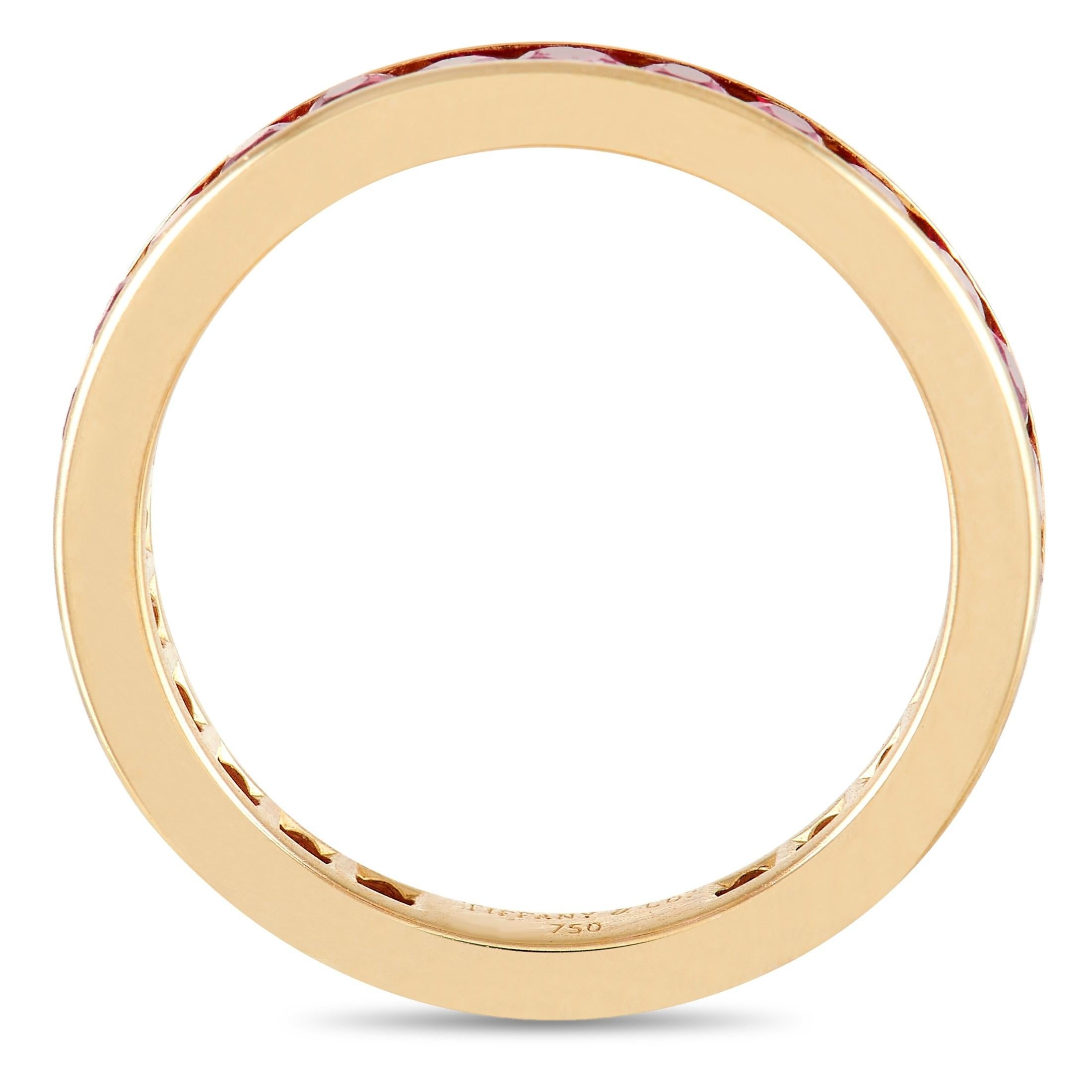 A series of round-cut rubies adorn the entirety of this sleek, sophisticated Tiffany & Co. ring. The 18K Yellow Gold setting features a 2mm wide band and a 1mm top height, making it a comfortable piece that is ideal for everyday wear. 