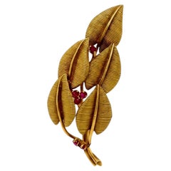 Tiffany & Co. 18k yellow gold ruby flower pin
