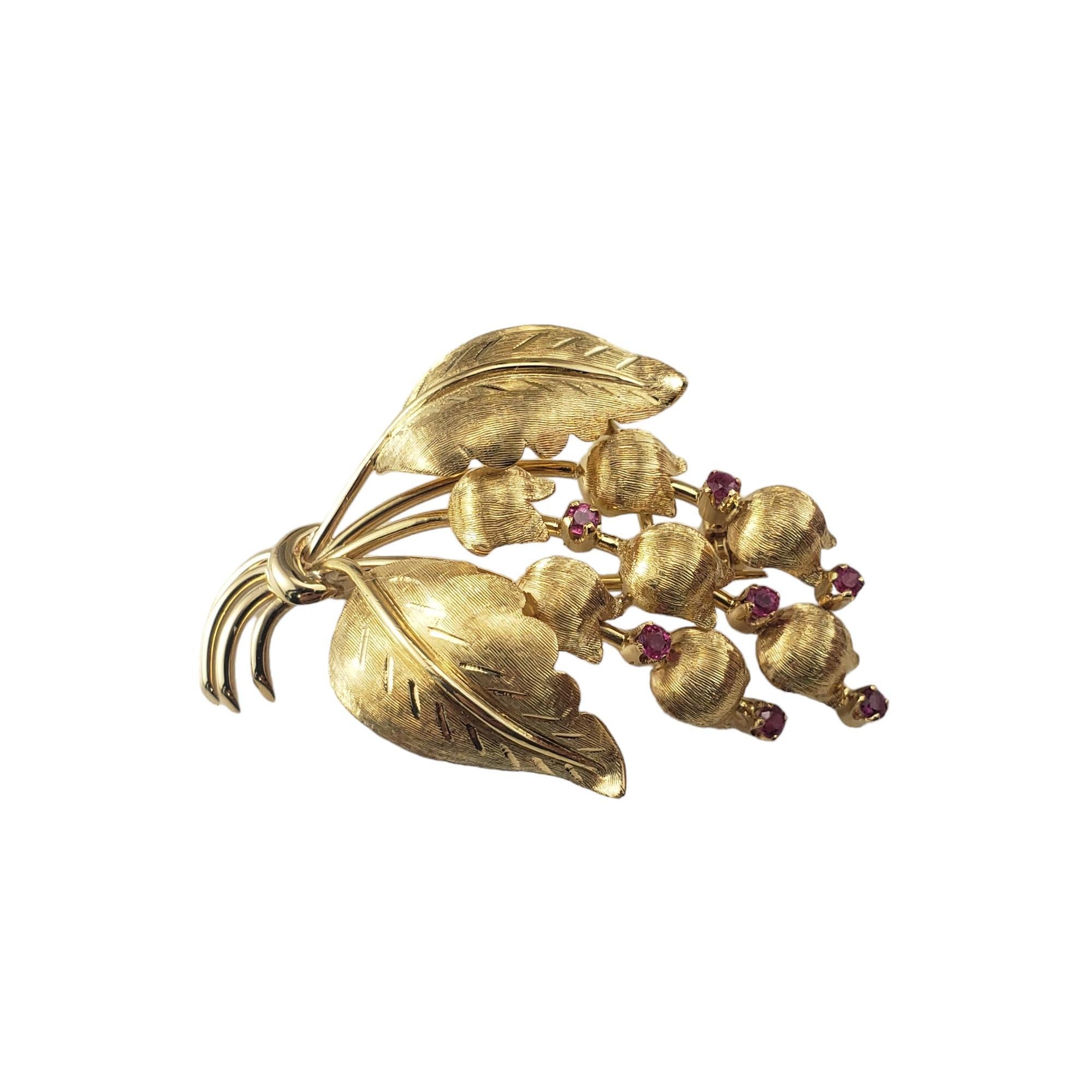 Vintage Tiffany & Co. 18K Yellow Gold and Ruby Lily of the Valley Brooch-

This exquisite Tiffany & Co. brooch features seven round faceted rubies set in beautifully detailed 18K yellow gold.

Size: 1.7 inches x 1.1 inches

Hallmark:  Tiffany & Co.