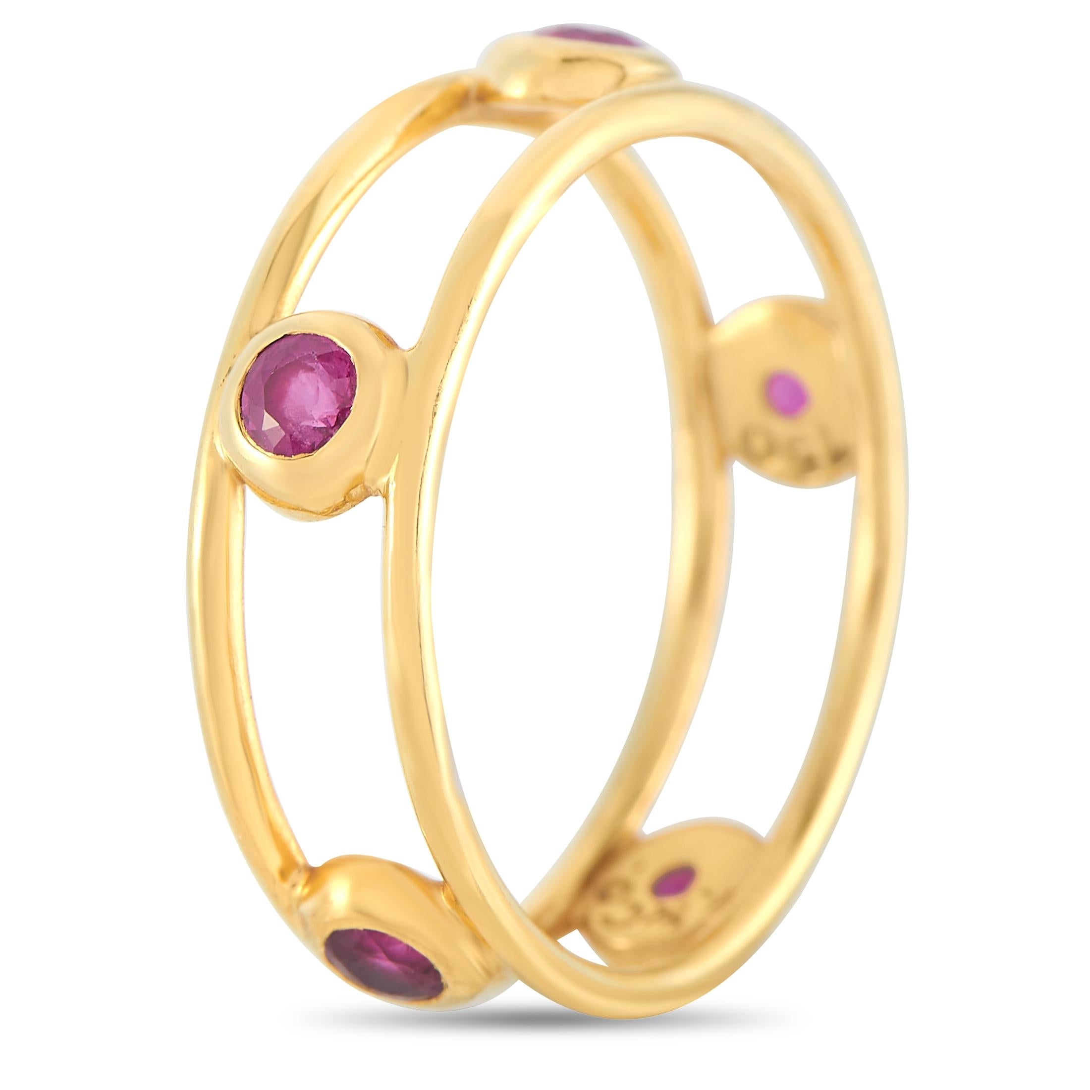 Spectacularly made with 18K yellow gold, this glamorous ring made by Tiffany & Co. is set with five ruby stones. The ring weighs 2.5 grams and boasts band thickness of 5 mm.

This jewelry piece is offered in estate condition and includes the