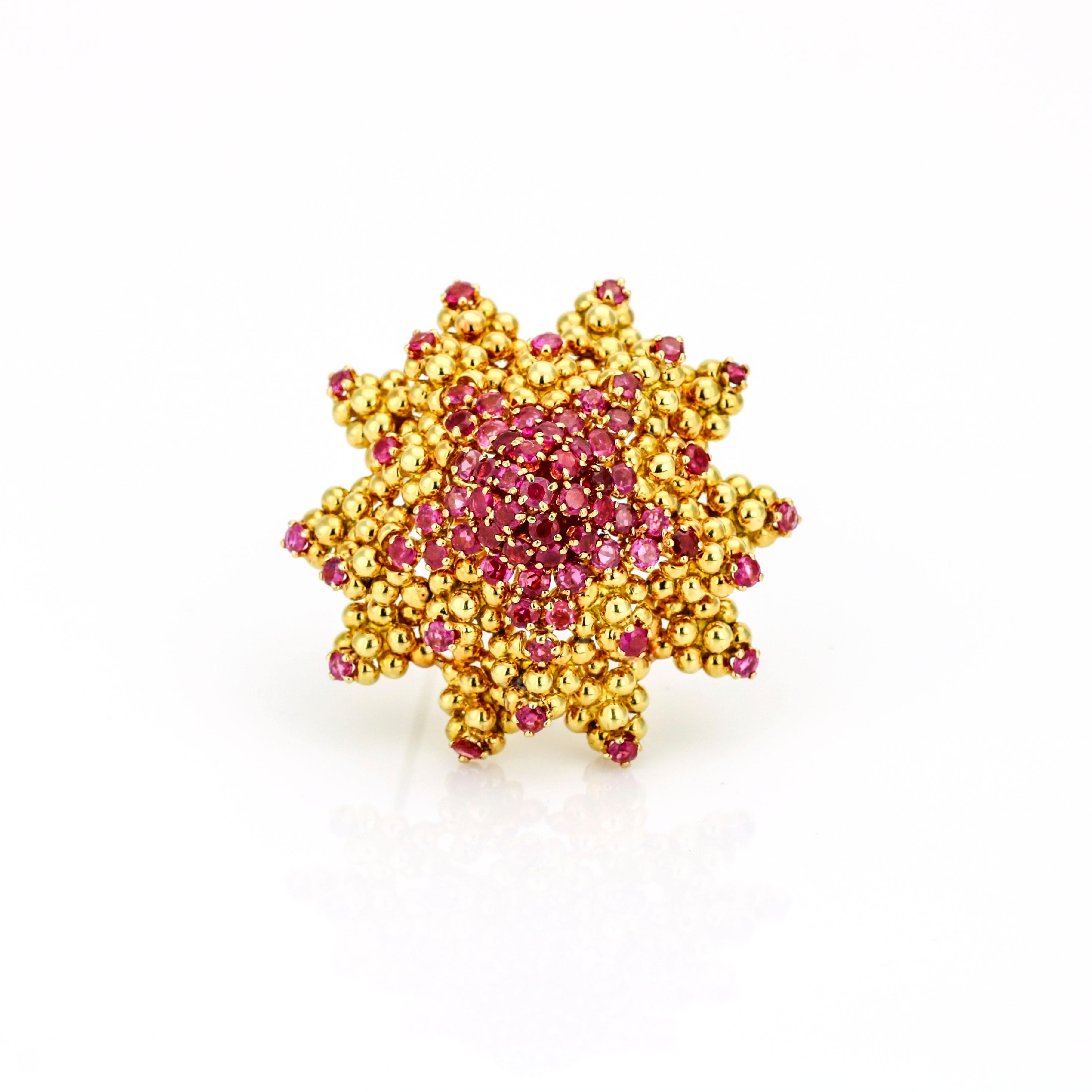 Vintage Tiffany & Co. sun starfish brooch in 18-karat gold with rubies. The starfish is made out of solid gold beads that are prong set with 61 round-cut natural rubies. Made in Italy. Circa 1950s.

Ruby Total Carat Weight, 3.35 carats