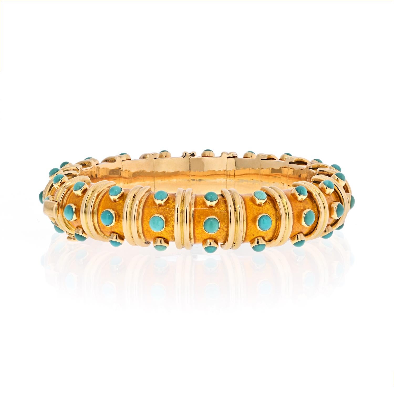 A highly rare and important example from Tiffany & Co. by Jean Schlumberger.  An exceedingly rare enamel color - a stunning copper orange - beautifully offset and tastefully dotted with 57 turquoise cabochons.
The bracelet is 13mm wide and about