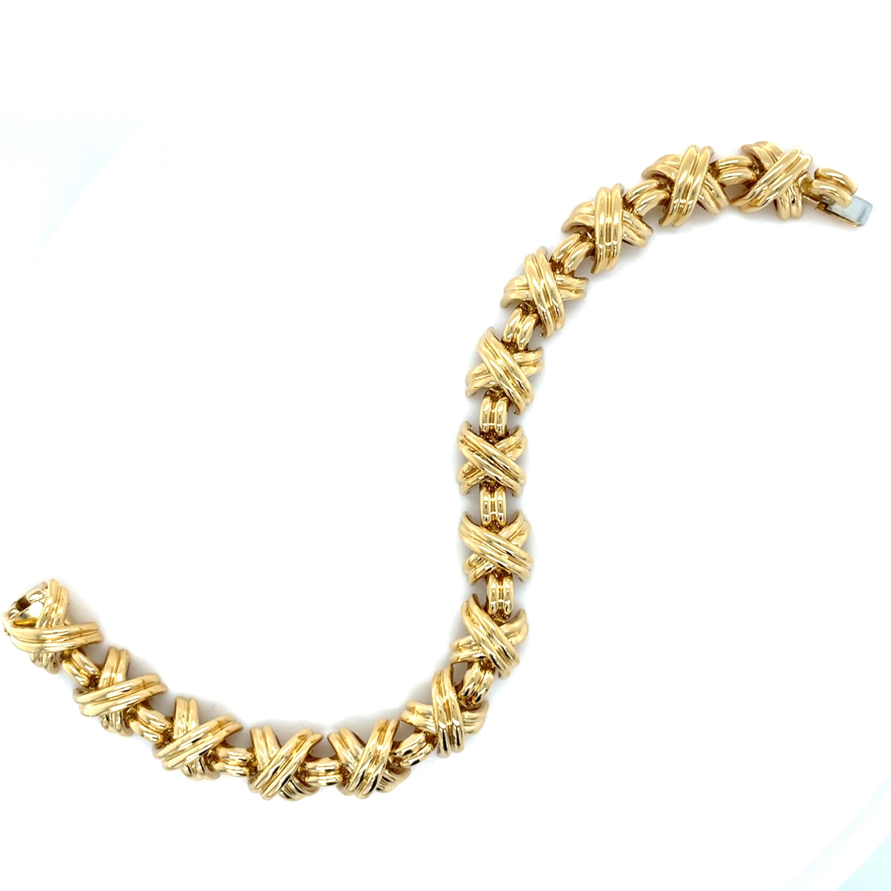 This classic bracelet by Tiffany & Co. is a part of their Signature X Collection. Crafted in high polished 'x' links this bracelet is perfect for both a formal occasion or a casual evening out. 

Measurements: 7 1/4 inches long and 10.00 mm