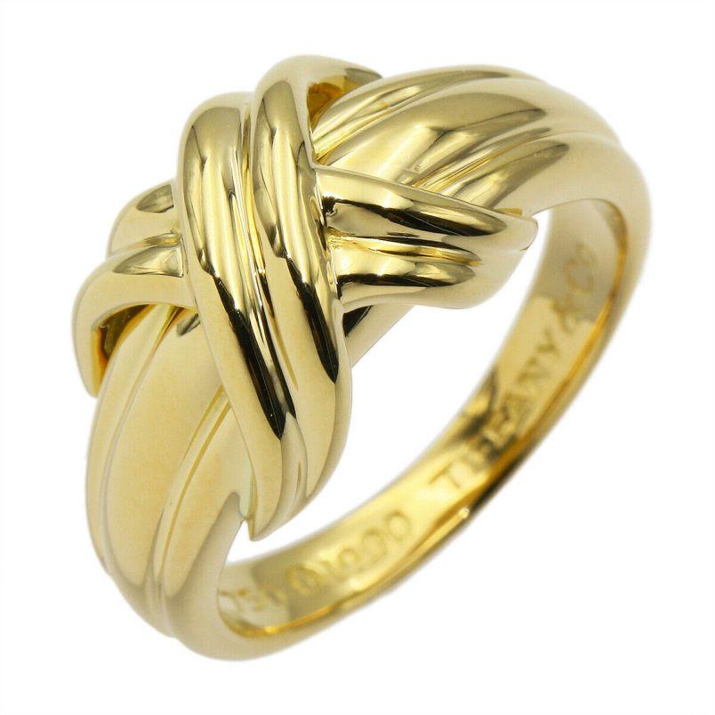 TIFFANY & Co. 18K Yellow Gold Signature X Ring 6.5

Metal: 18K yellow gold 
Size: 6.5
Width: 9.5mm at the widest point on the top
Weight: 5.80 grams
Hallmark: ©1990 TIFFANY&CO. 750
Condition: Excellent condition, like new

Limited edition, no longer