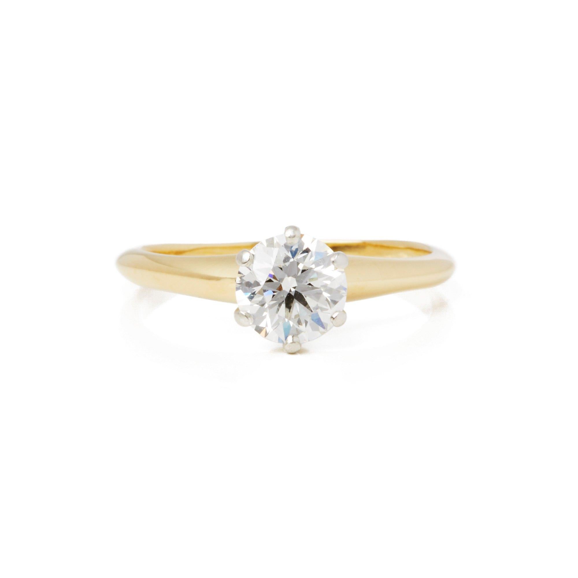 This Ring by Tiffany & Co features a Single Round Brilliant Cut Diamond G Colour, VS2 Clarity in a claw setting totalling 0.85cts. Mounted in 18k Yellow Gold. Finger Size UK L, EU Size 52, USA Size 6. This Ring can be re-sized. Complete with