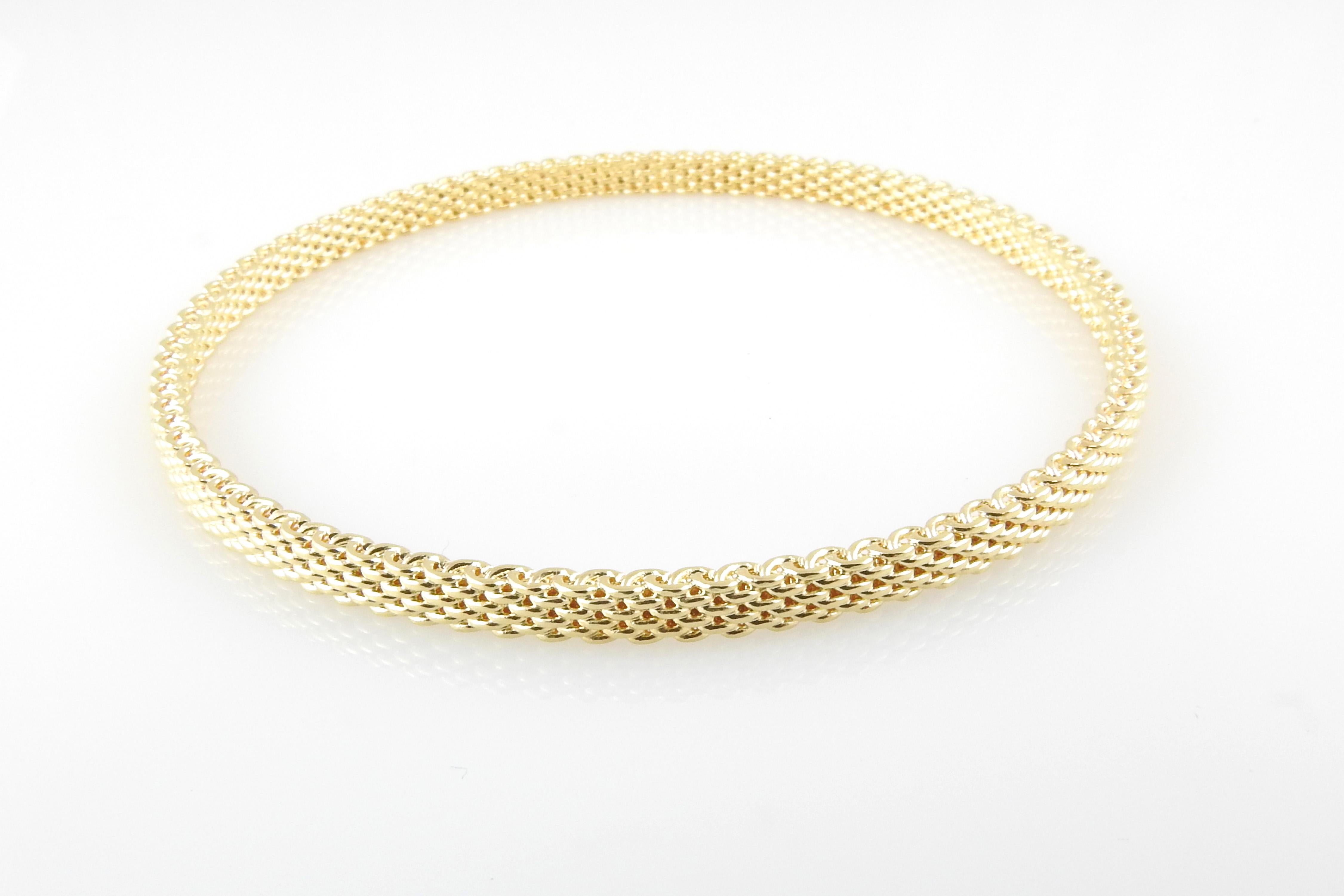 Tiffany & Co. 18K Yellow Gold Somerset Mesh Bracelet

This beautiful Tiffany & Co. mesh bangle bracelet is set in 18K yellow gold.

**Matching bracelets available in our store in rose and white gold**

Bracelet is approx. 4mm wide, and 8