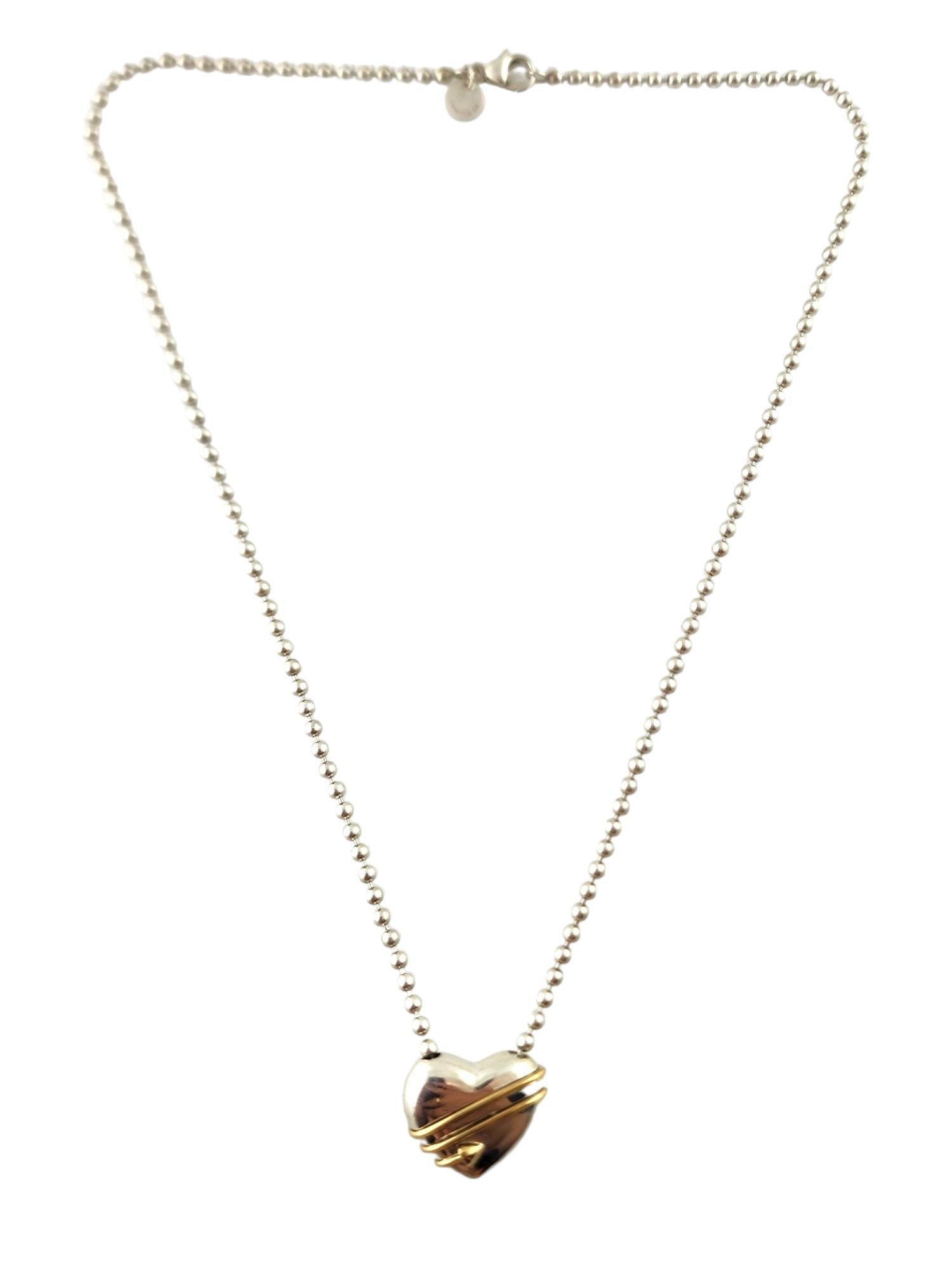 Tiffany & Co 18K Yellow Gold & Sterling Silver Heart Arrow Necklace

This beautiful necklace by designer Tiffany & Co. was meticulously crafted from sterling silver with a beautiful 18K yellow gold arrow wrapped around the heart pendant!

Chain