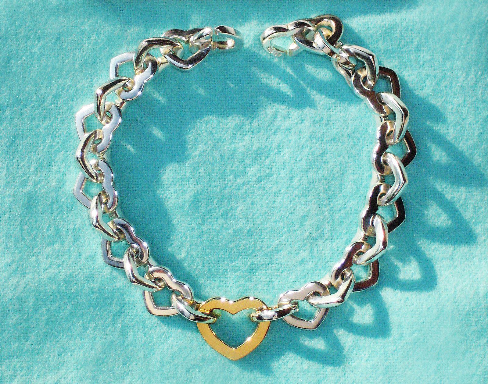 100% Guaranteed Authentic Tiffany & Co. 18K Gold & 925 Sterling Silver Heart Bracelet, Hallmarked 750 & 925 ©Tiffany & Co
18K Gold Heart Measures 5/8