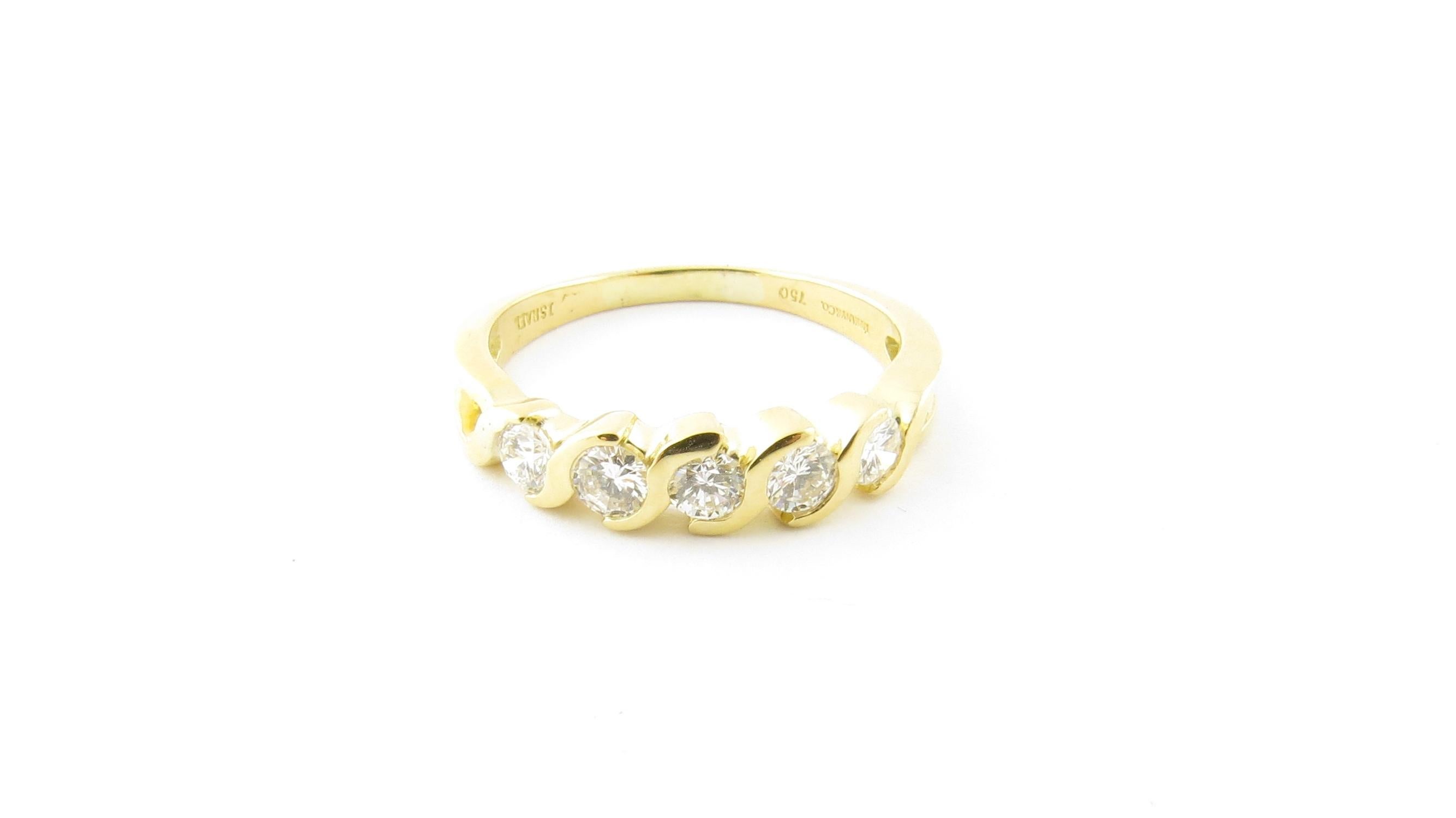Tiffany & Co. 18K Yellow Gold Swirl Semi Bezel Set Diamond Band

This authentic diamond band is a size 6.75

It is set with 5 round brilliant diamonds approx. .50 cts total

Diamonds are of VS clarity, F-G color

Stamped Tiffany & Co. 750