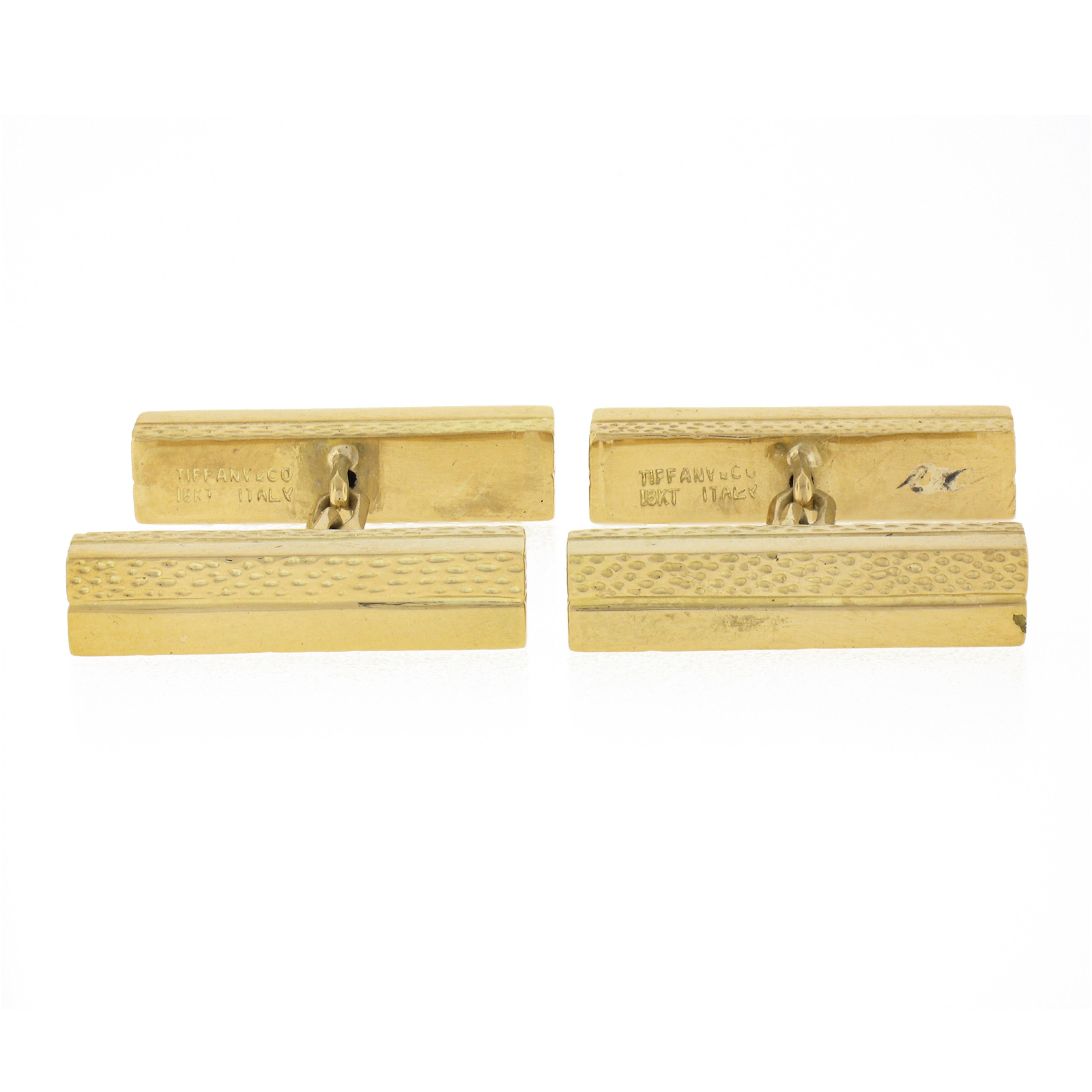 These fine vintage Italian Tiffany & Co. cuff links were crafted from solid 18k yellow gold it features dual panels of nice geometric box shape. The panels are both textured and smooth polished finish throughout. This amazing pair of cufflinks