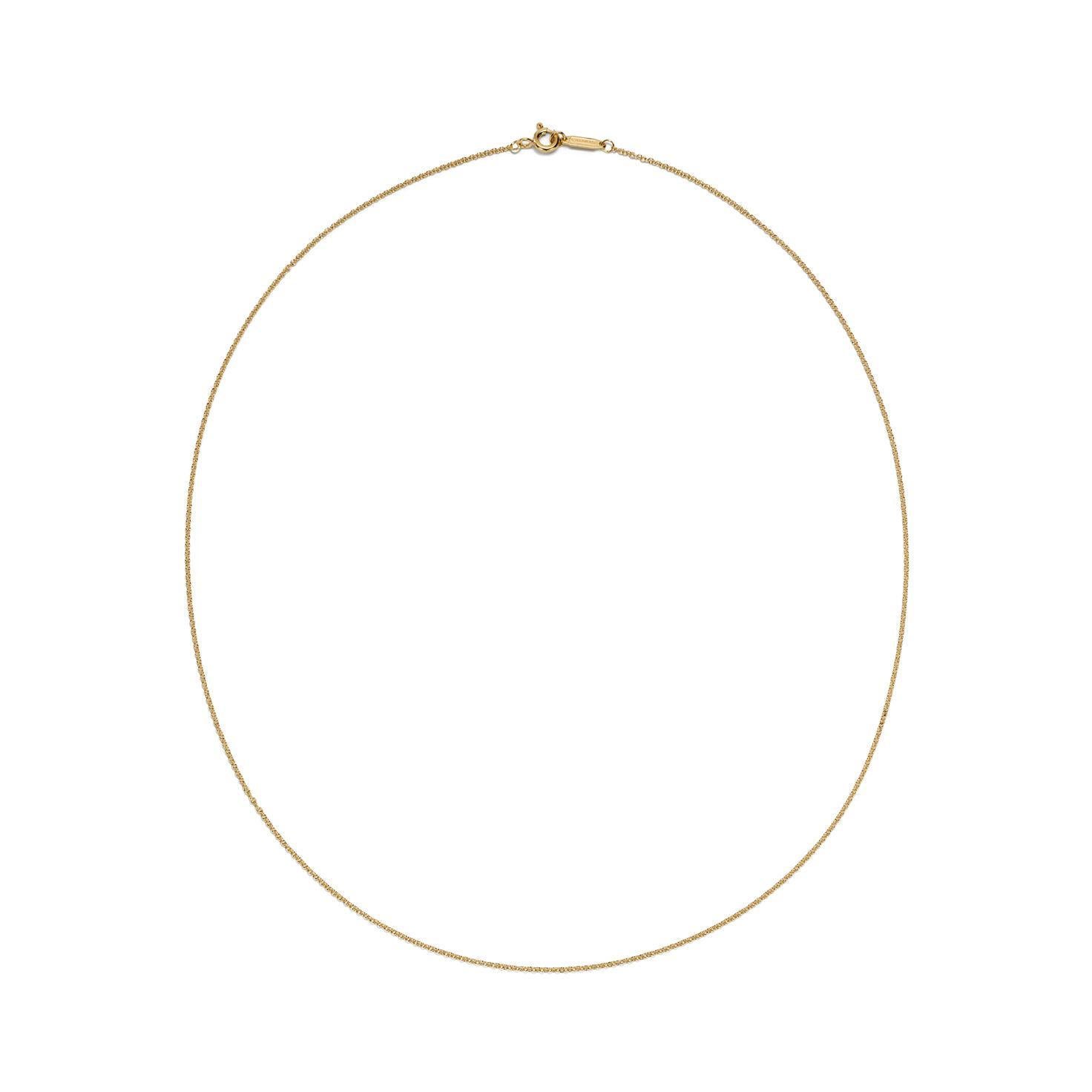 Marque : Tiffany & Co.
Métal : Or jaune 18k
Type : collier fin Chaîne
Longueur : 18 pouces
Élevez votre collection de bijoux avec l'exquis collier à chaîne en or jaune 18 carats de Tiffany & Co., une pièce étonnante qui incarne l'élégance et la