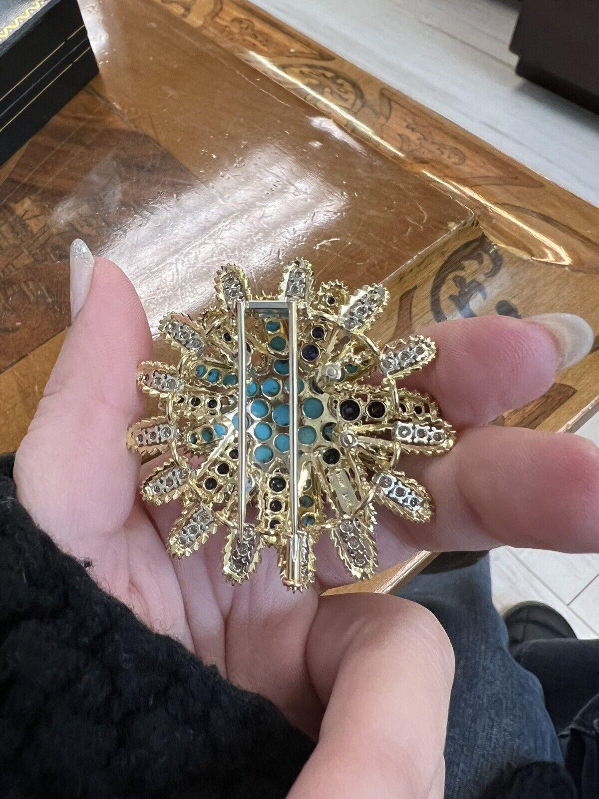Tiffany & Co. 18k Yellow Gold, Turquoise, Sapphire & Diamond Brooch Vintage

Here is your chance to purchase a beautiful and highly collectible designer brooch.  Truly a great piece at a great price! 

The weight is 34 grams.  

The length is 2