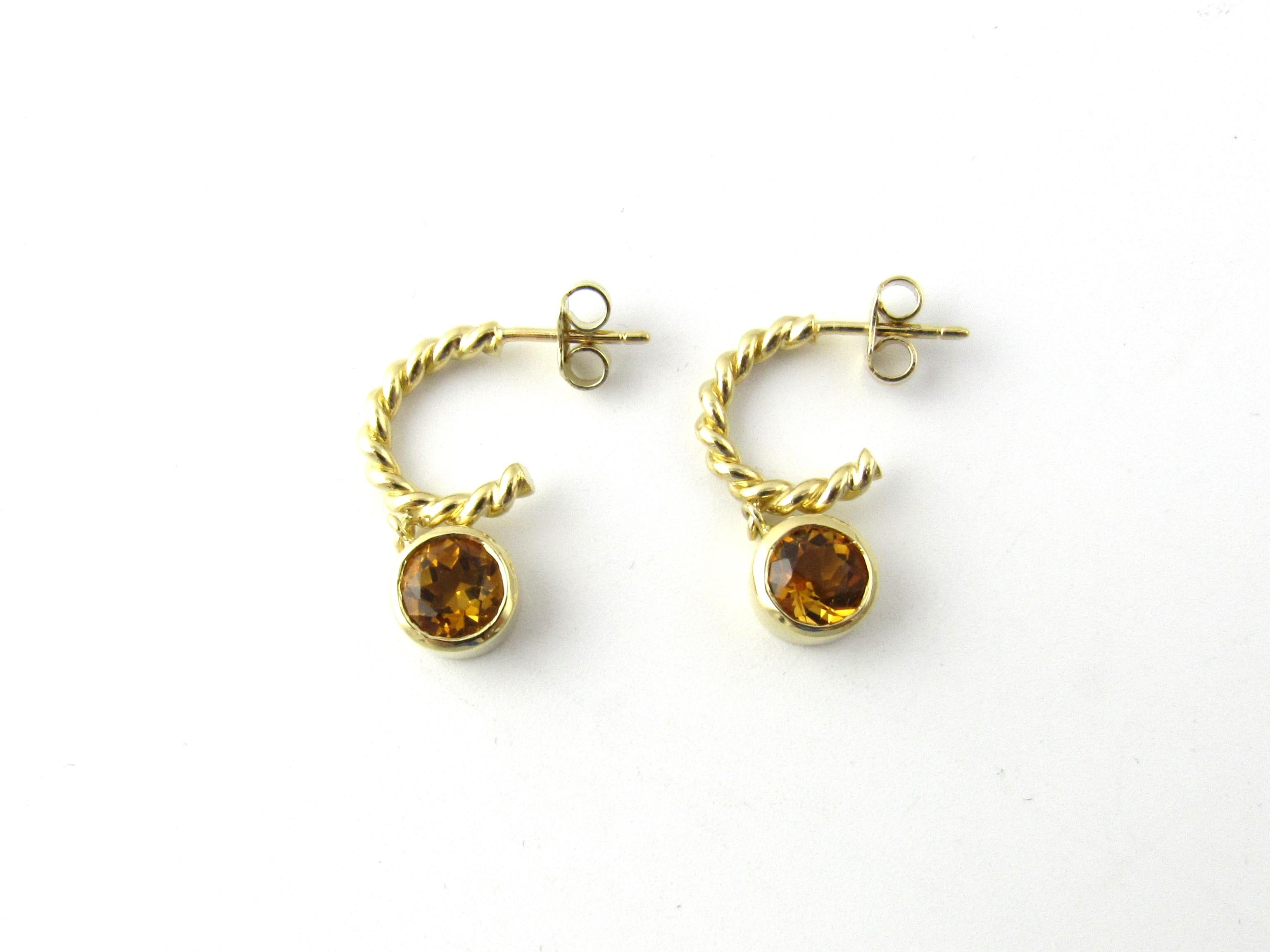 Tiffany & Co. 18K Yellow Gold Twisted Rope Citrine Earrings

These authentic Tiffany earrings are mini twisted rope hoops with bezel set dangling citrine stones.

The hoops are approx. 2mm wide and 13mm in length.

Faceted citrine stones are are