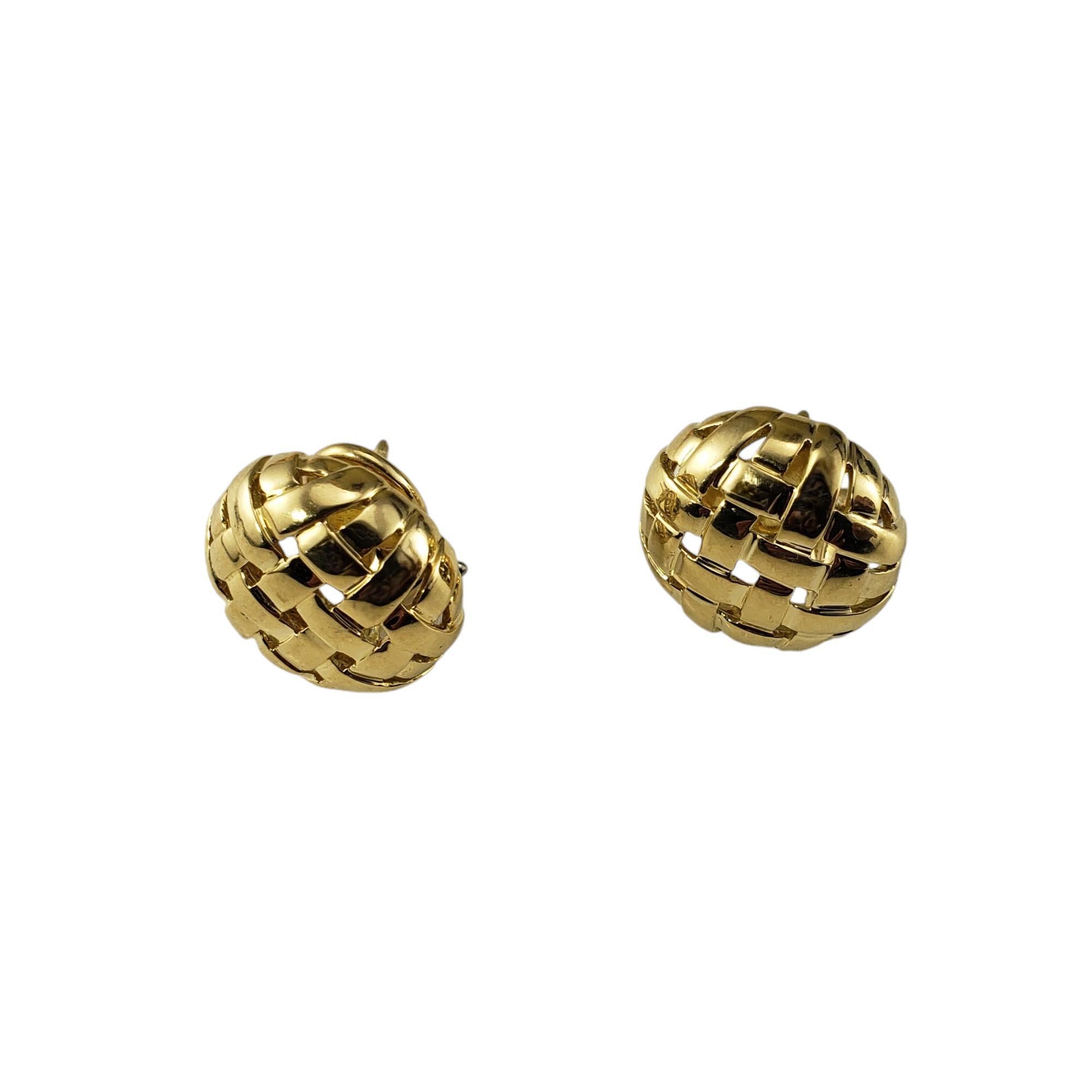 Tiffany & Co. 18 Karat Yellow Gold Vanneire Basketweave Earrings-

These stunning earring by Tiffany & Co. are crafted in beautifully detailed 18K yellow gold in an elegant basket weave design.  Omega back closures.

Hallmark:  T&CO 
 750
 
