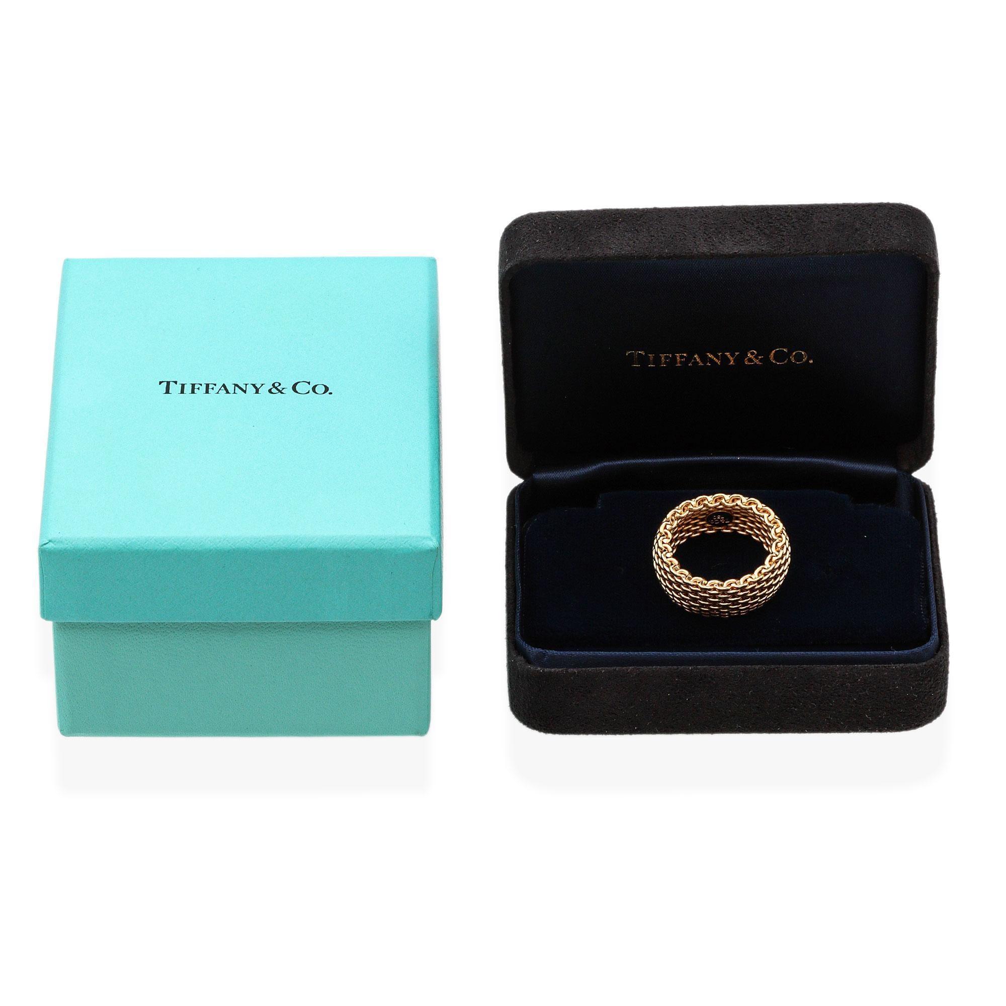 This vintage Tiffany & Co. wide Somerset mesh ring exemplifies timeless elegance and masterful craftsmanship. Made from luxurious 18K yellow gold, the ring features a distinctive woven mesh design that offers both flexibility and comfort while
