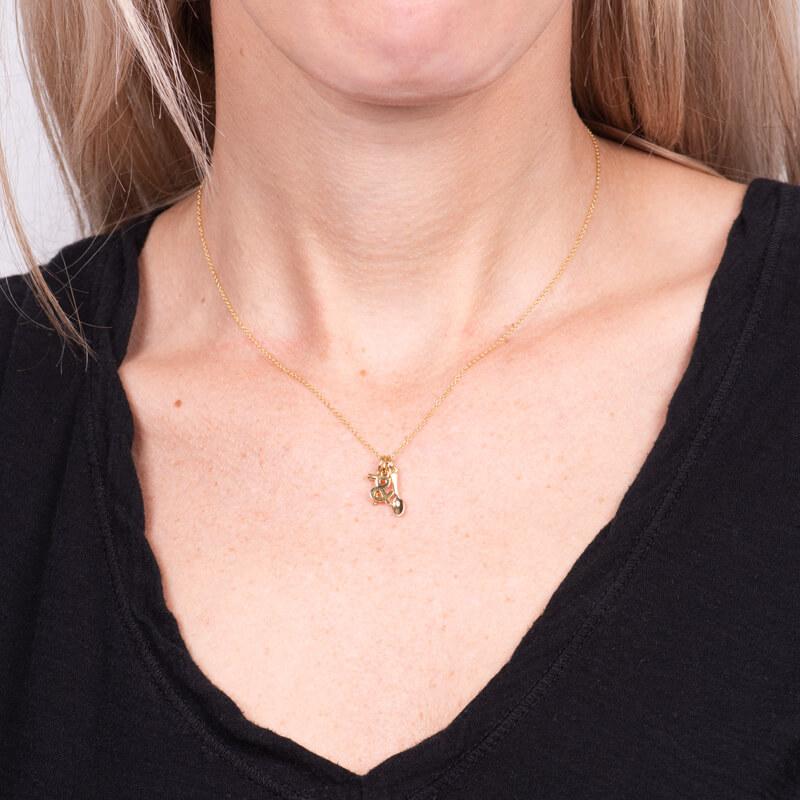 This unique pendant necklace is crafted from 18 karat yellow gold and features three charms, a corkscrew, an ampersand, and a spoon.  
Length: 16-18