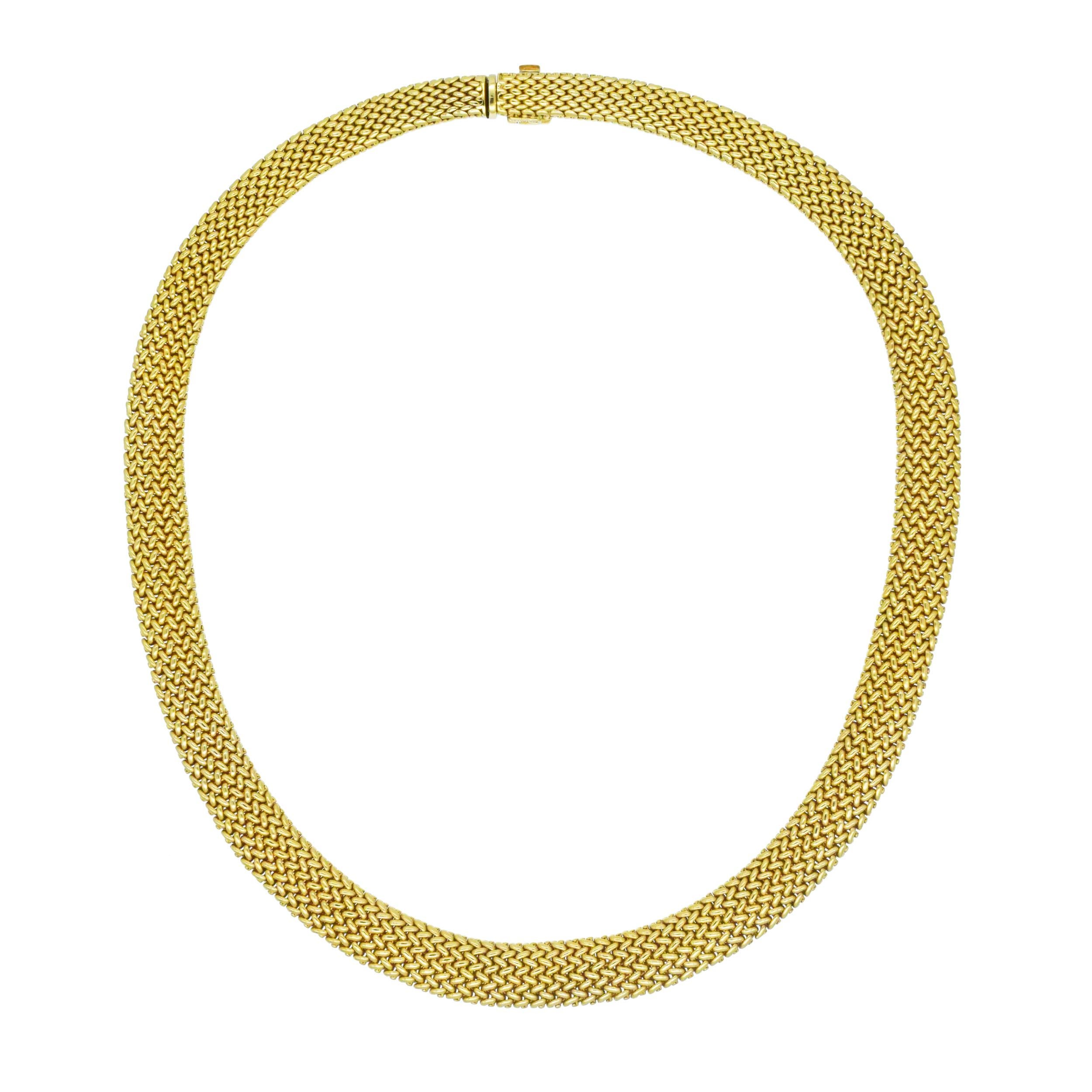 Tiffany & Co. 18k Yellow Gold Woven Necklace. The
necklace features tapered woven mesh design. Equipped with the box clasp with fold over safety closure. Inscribed: Tiffany&Co., 750.
Length: 16.5 inches. Width: 10.5mm -
7mm. Weight: 64.3 grams